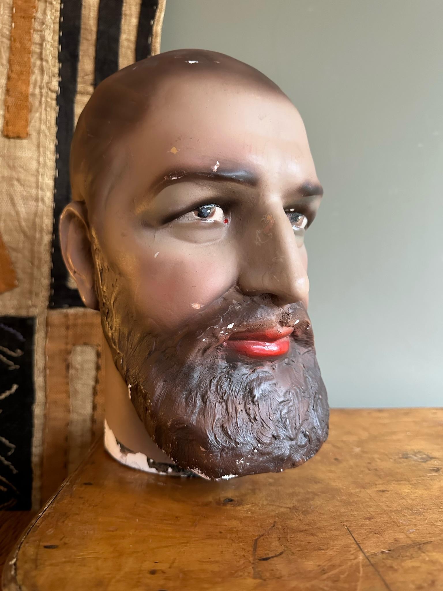 Plaster male mannequin head.
A vintage life size head with beard and brown eyes.
An elegant man with beautiful painted eyes and lips.

Can placed on a mannequin or used as a display.

A great decorative object for your home.