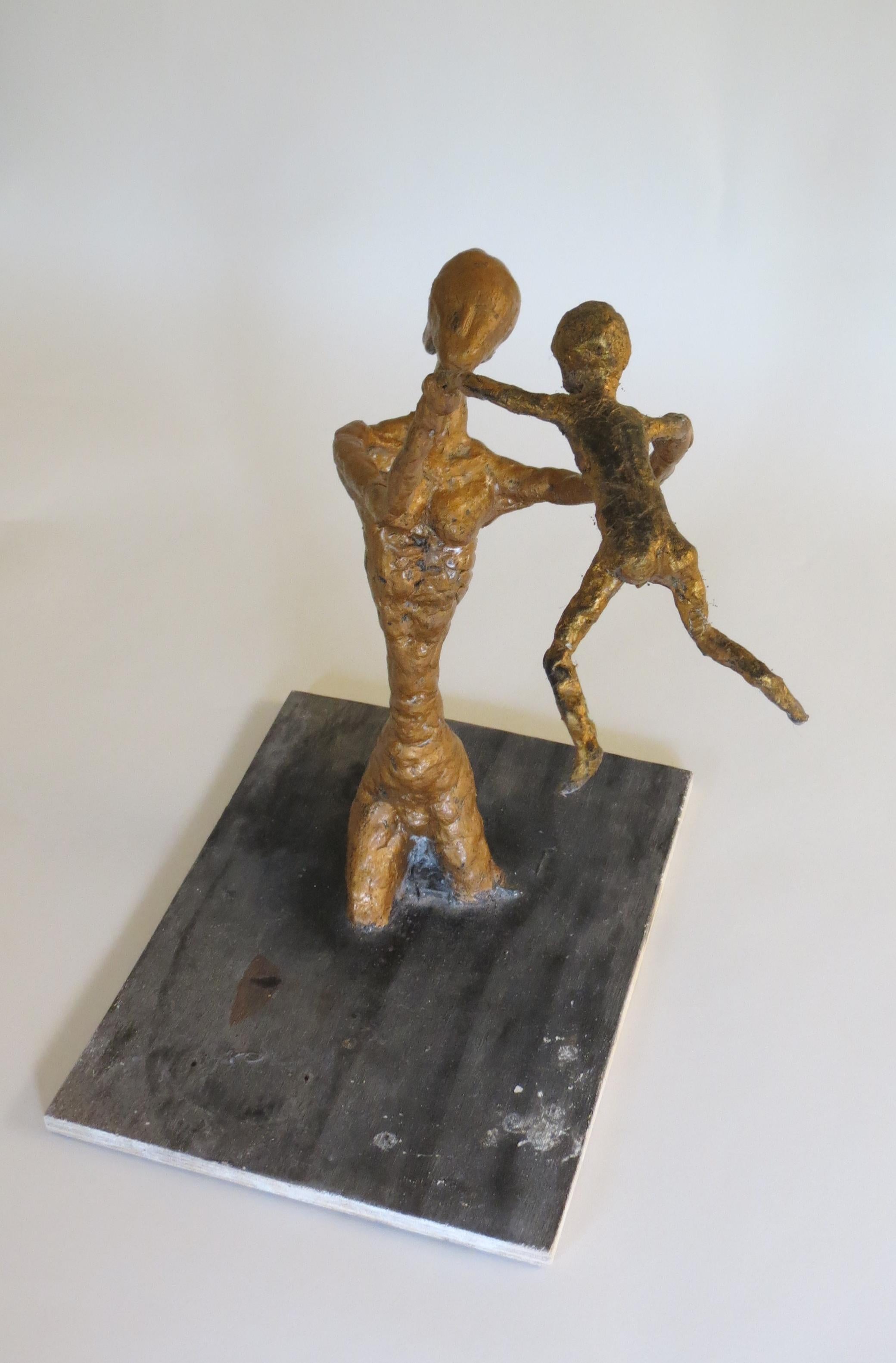A unique plaster maquette of mother and boy child. Hand produced by Bill Young, year 2000.

On original board, good over all condition, some minor loss to paint.

This piece came from the deceased artist's estate. 

   