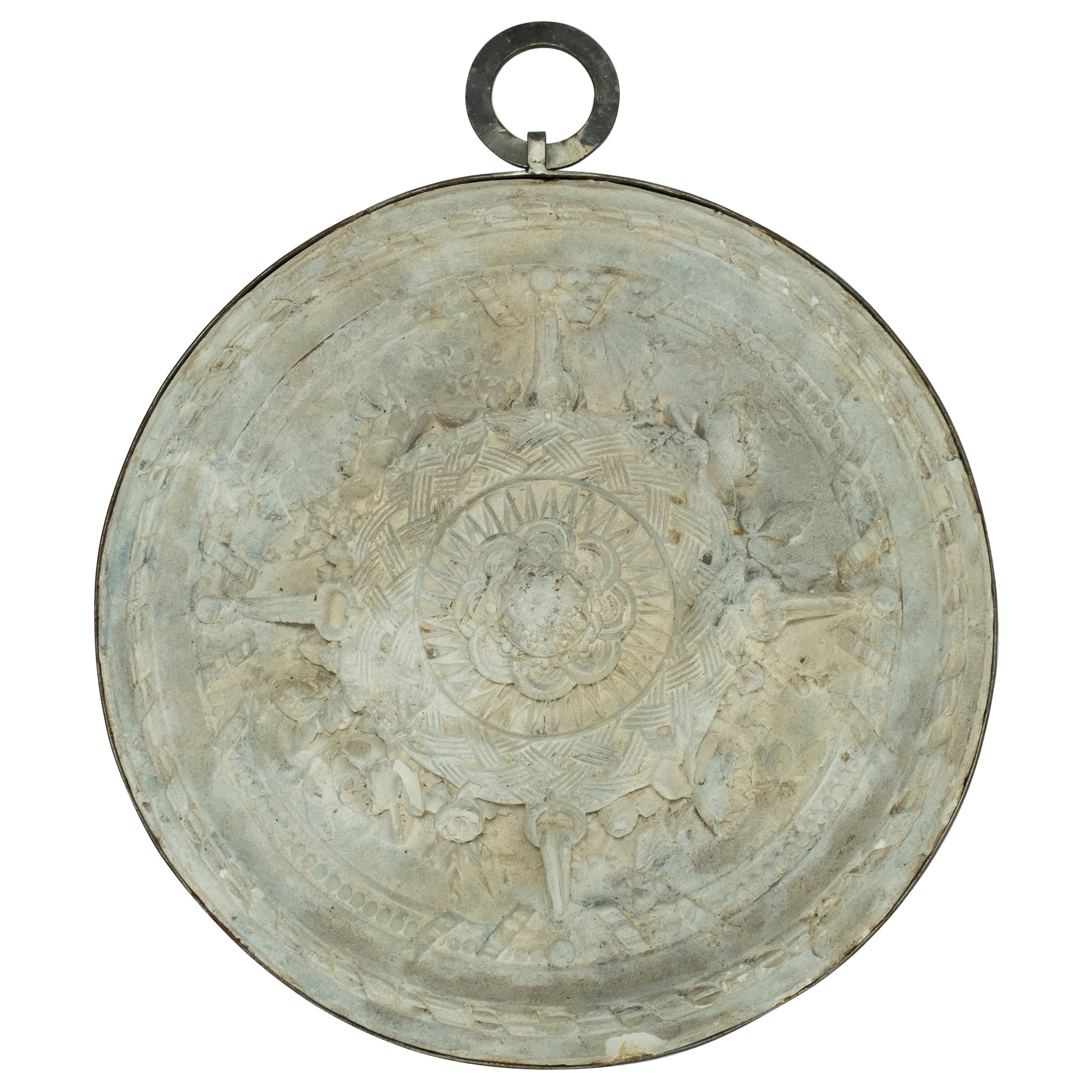 Plaster Medallion Wrapped in Iron