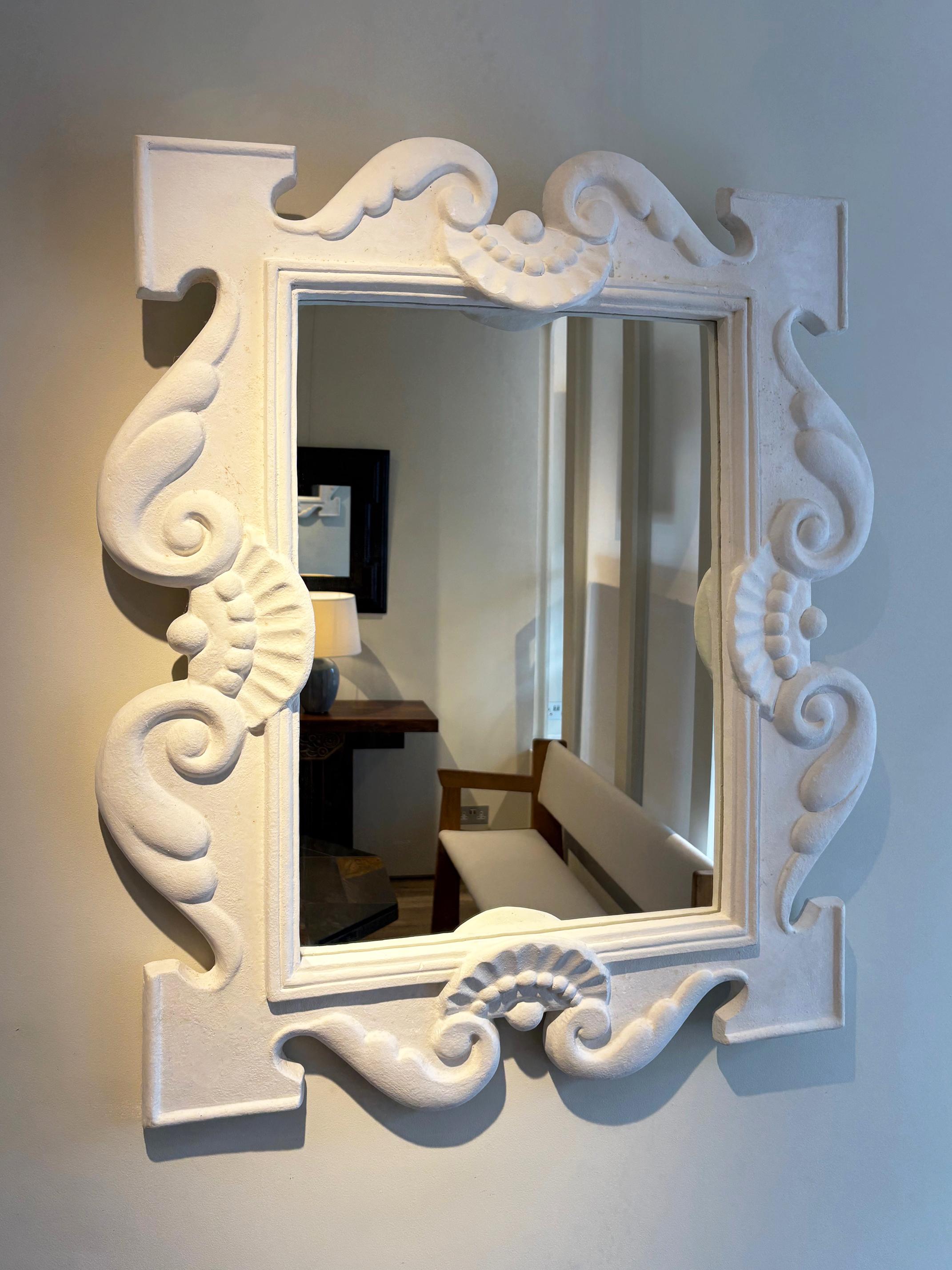 A plaster mirror, after Serge Roche (1898-1988).
Limited re-edition by Pierre Passebon - Galerie du Passage in the 1980s.
The original, by Serge Roche made in the 1940s, is owned by Passebon's partner, the famed decorator Jacques Grange, and is hung