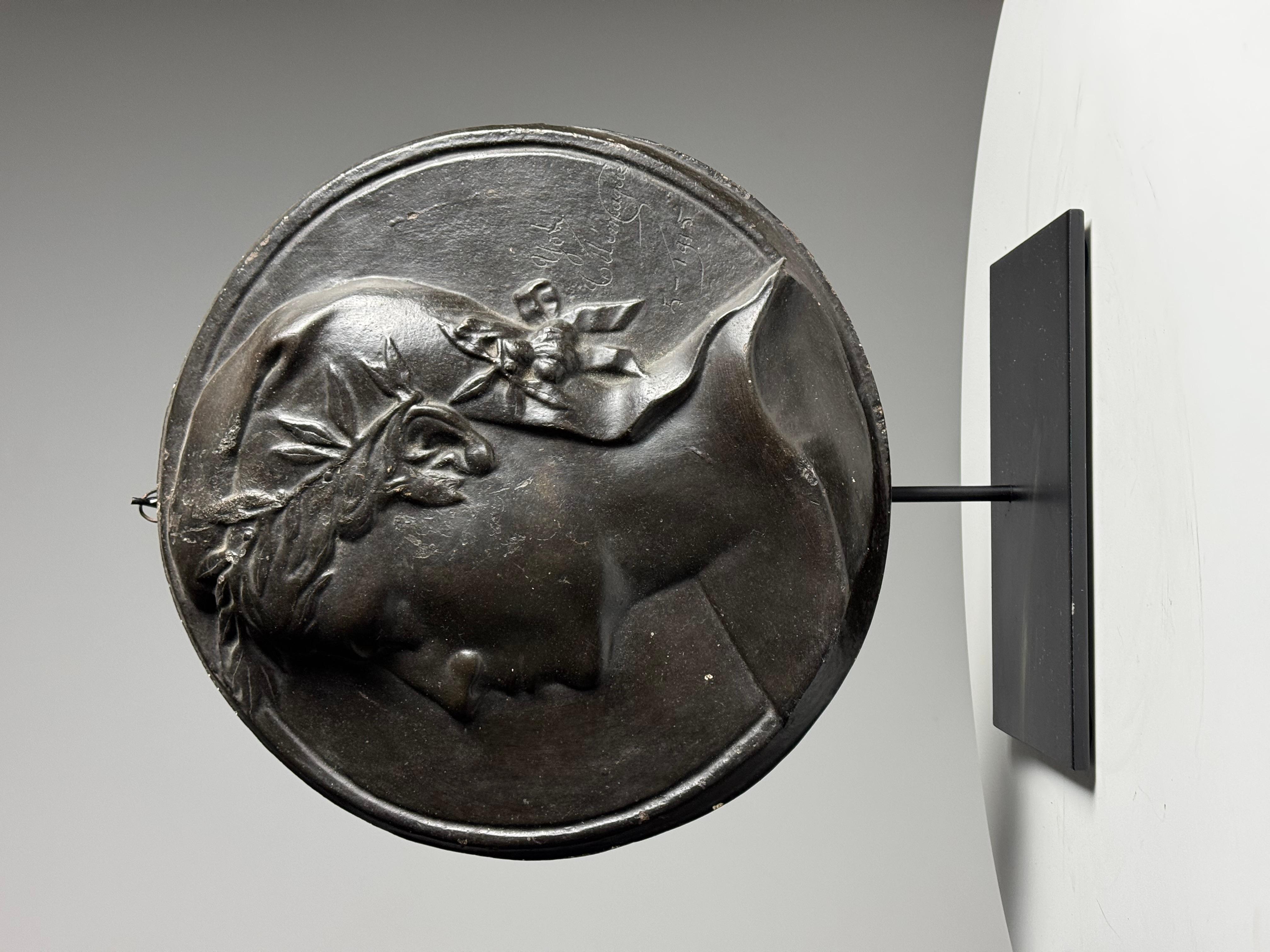Plaster Plaque / Medallion. Signed, From 1915. Originating from France. Can be hung on wall or on stand like this one.

