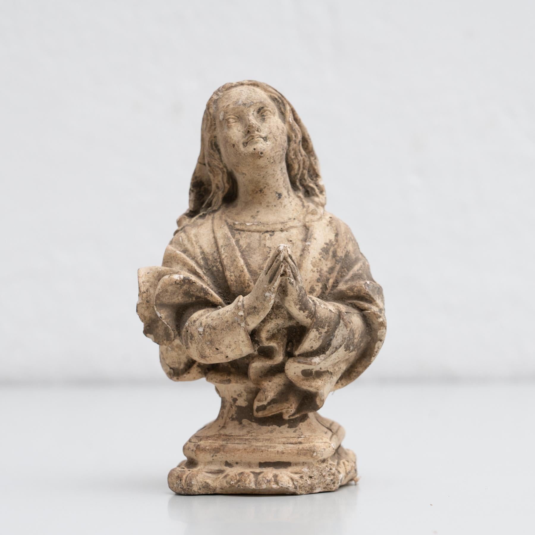 Traditional religious plaster figure of a praying woman.    Made in traditional Catalan atelier in Olot, Spain, circa 1950.    In original condition, with minor wear consistent with age and use, preserving a beautiful patina.    Olot has a long