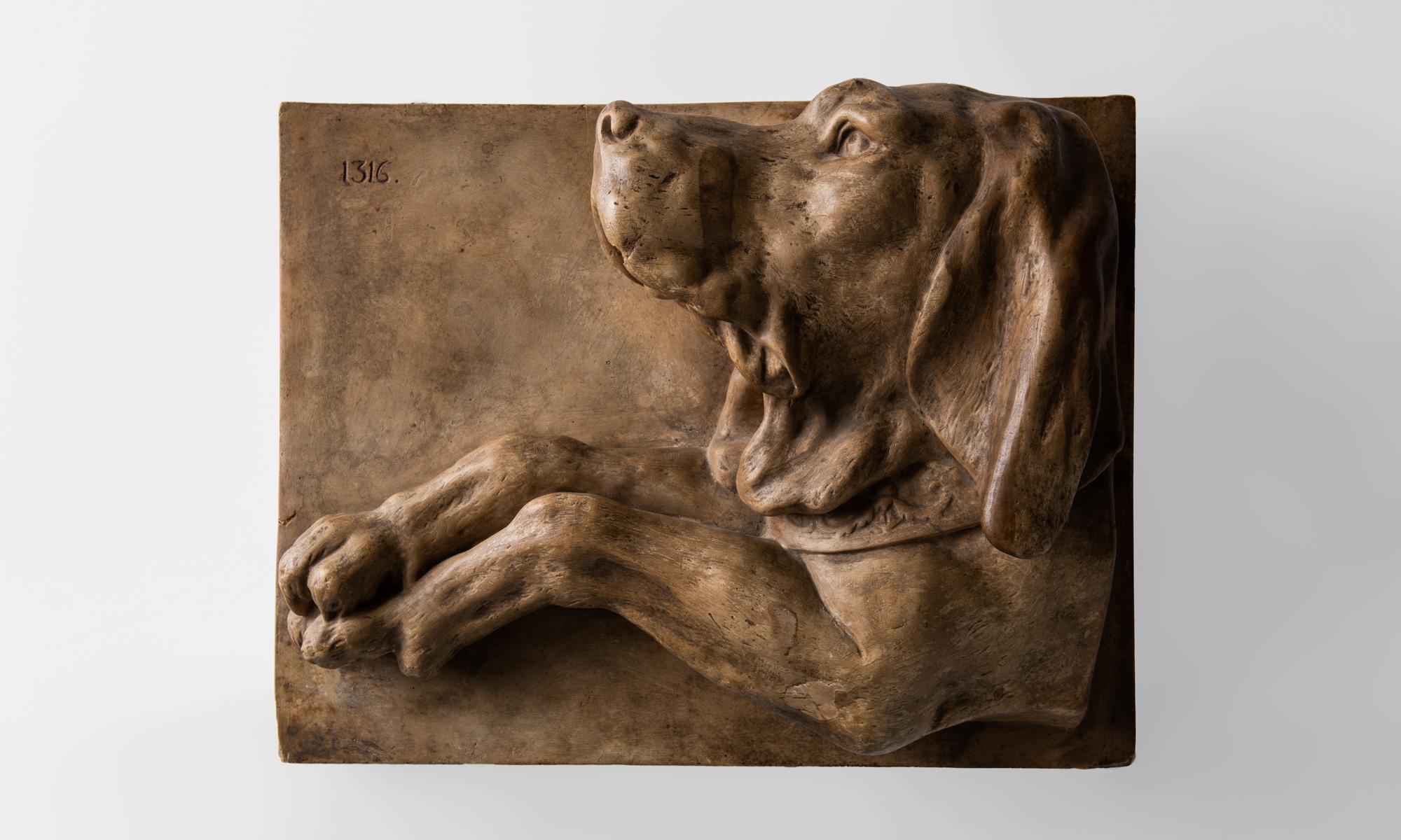 Plaster relief of a hound, England, circa 1890.

Cast sculpture with original paint and life-like detail.

    