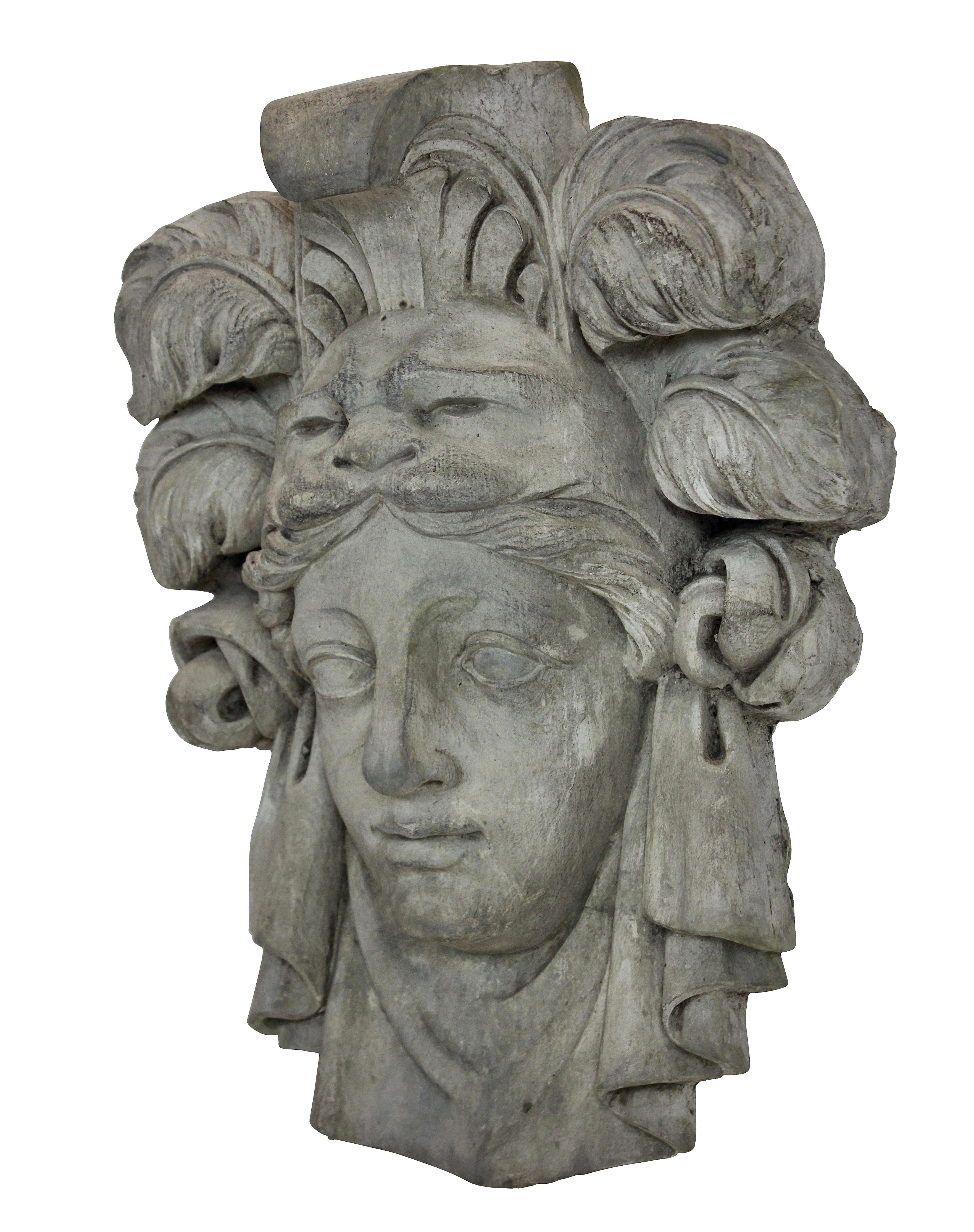 A English plaster wall plaque of Alexander the Great in herculean headdress.
  