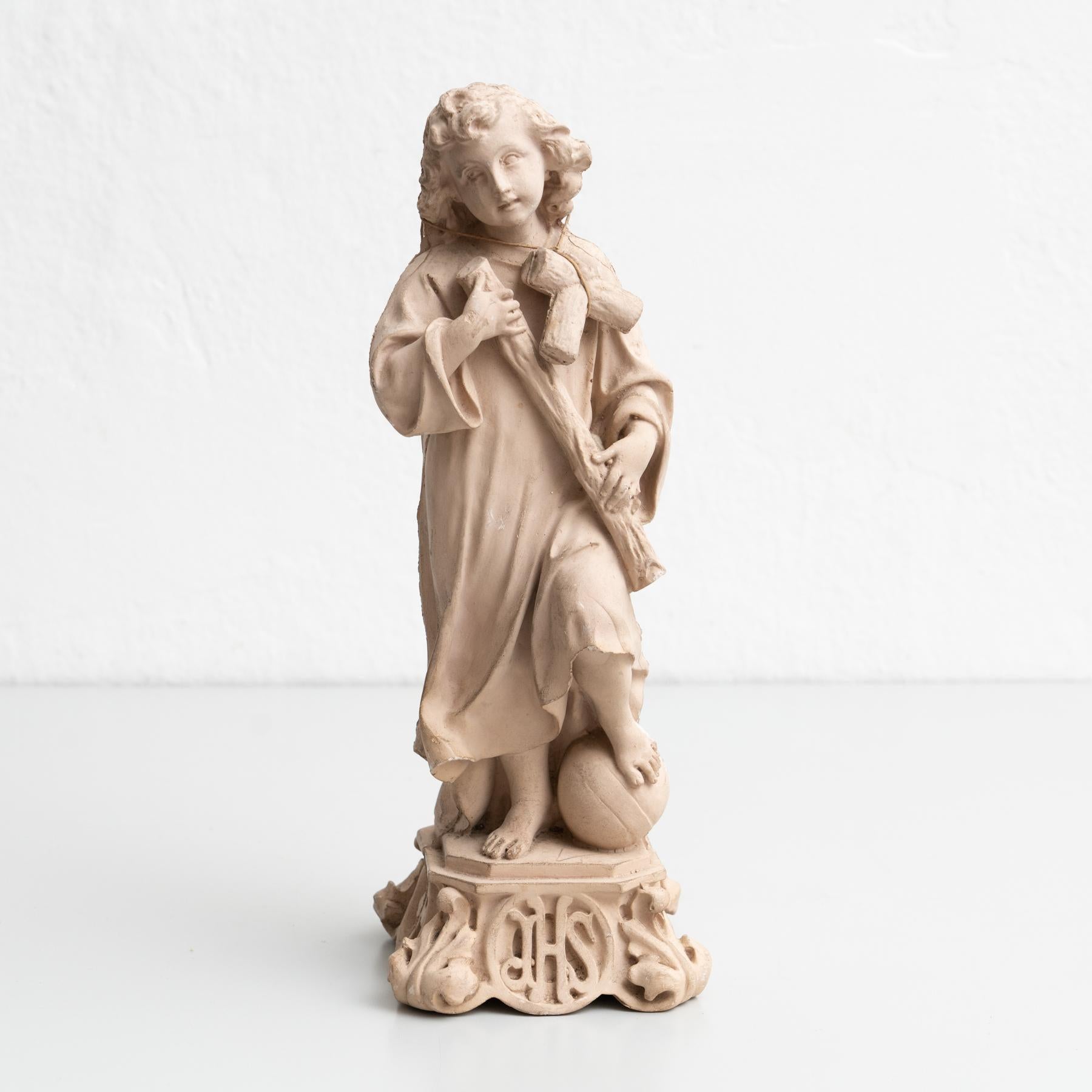 Traditional religious plaster figure of baby Jesus Christ.  Made in traditional Catalan atelier in Olot, Spain, circa 1950.  In original condition, with minor wear consistent with age and use, preserving a beautiful patina.  Materials: Plaster.     