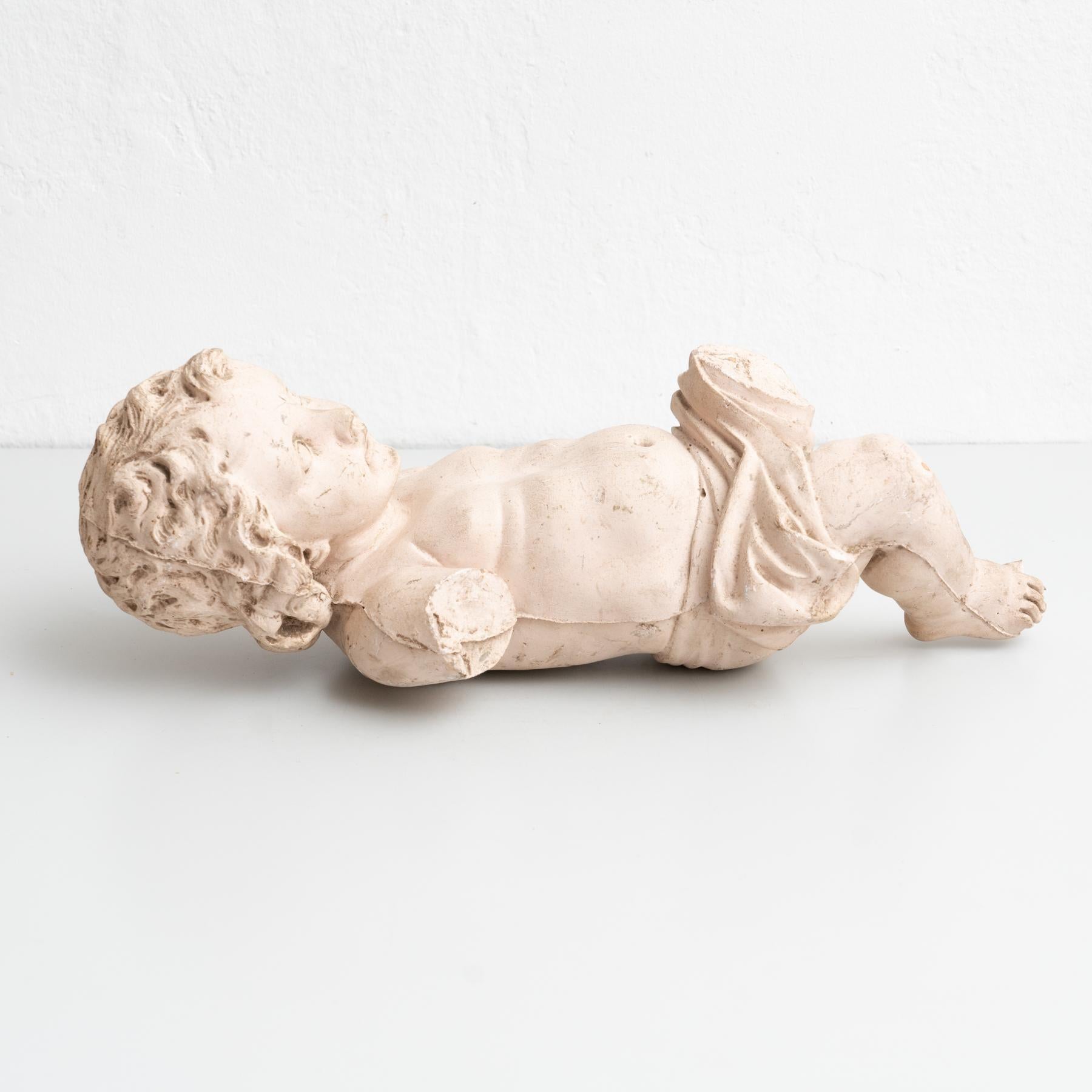 Traditional religious plaster figure of baby Jesus Christ.    Made in traditional Catalan atelier in Olot, Spain, circa 1950.    In original condition, with minor wear consistent with age and use, preserving a beautiful patina.    Materials: 