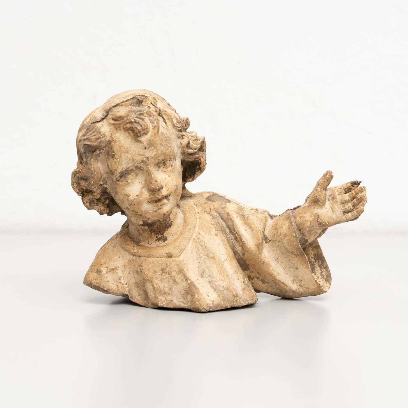 Traditional religious plaster figure of a baby Jesus.

Embodied within this exquisite plaster figure, portraying the beloved infant Jesus, is a sacred aura of tradition. 
Crafted in a traditional Catalan atelier nestled in Olot, Spain, around 1950,