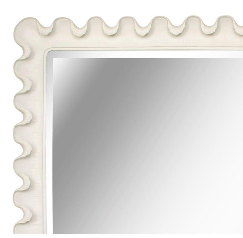Scalloped mirror in plaster.
