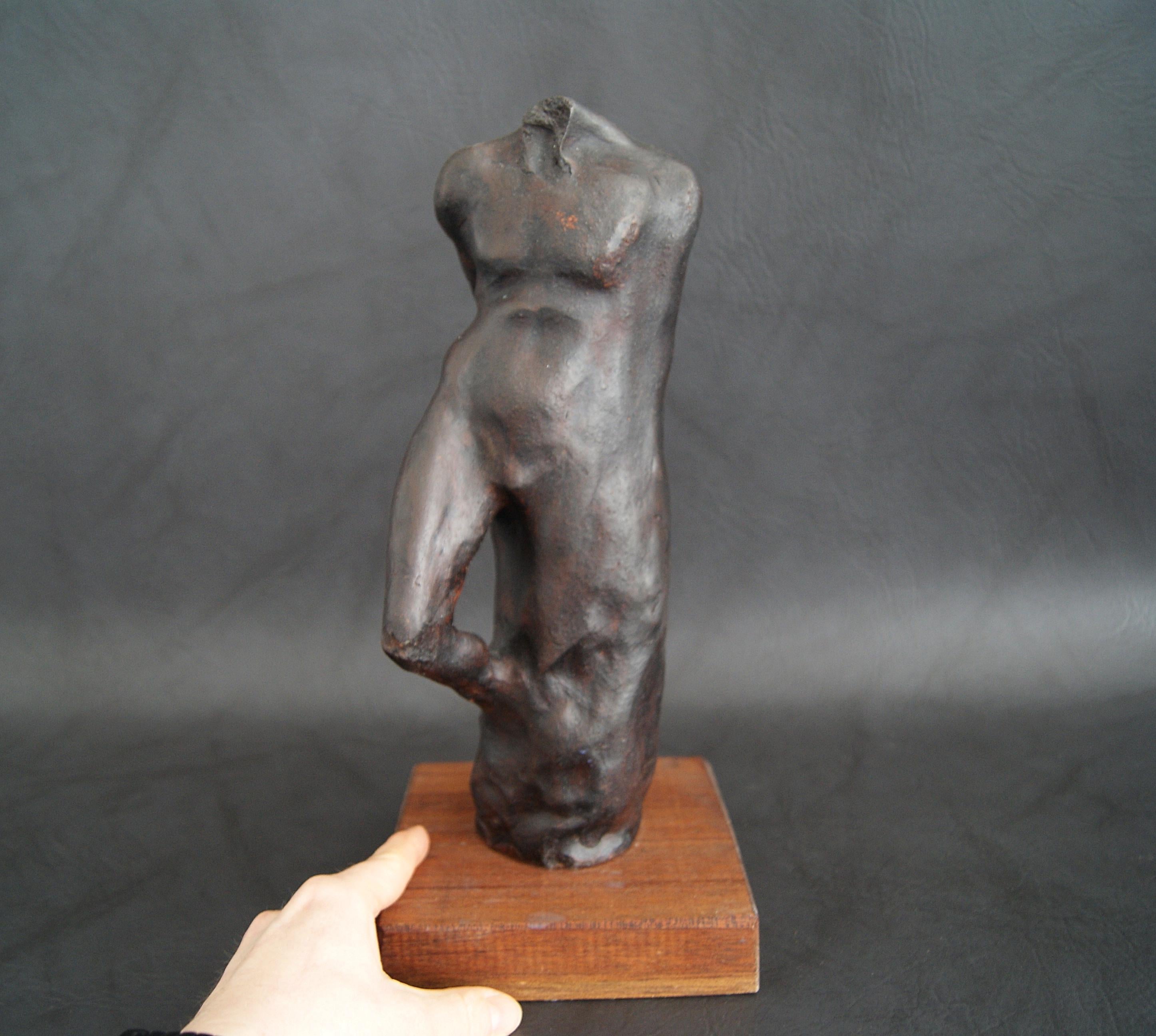 Handmade plaster figure with patinated bronze on a wooden base. The sculpture is by the German artist TADÄUS from the series formless body shapes from 2002. A very decorative individual piece that invites you to interpret. The natural materials and