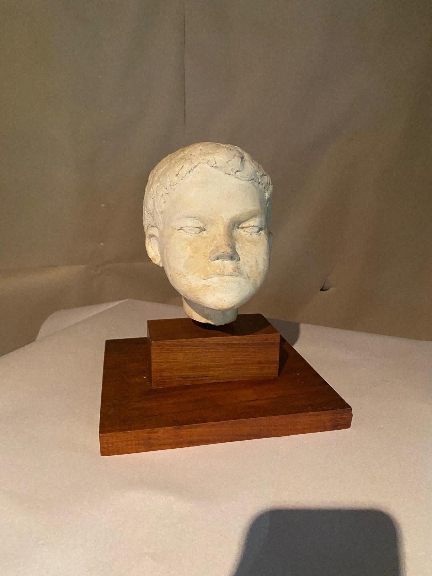 Plaster sculpture bust of young boy
the dimensions are with the base.