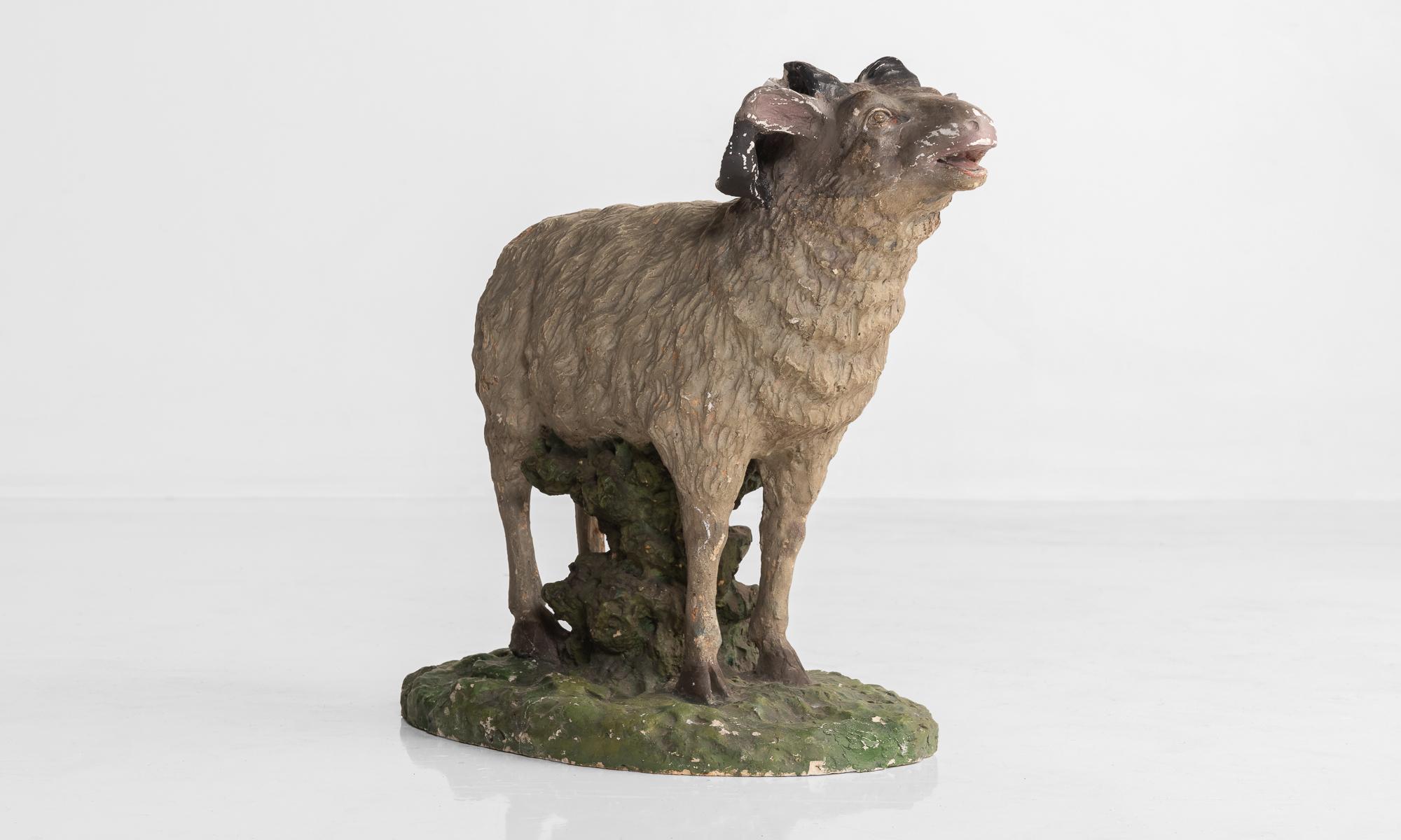 Plaster sculpture of sheep, circa 1950.

Painted, playful sheep, cast in plaster.

Measures: 13.75