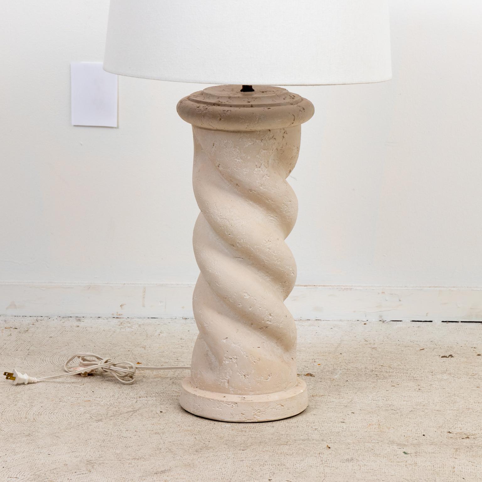 Circa mid-20th century vintage plaster spiral column table lamp in the style of Michael Taylor. The casting show intentionally distressed appearance and aged patina. Good vintage condition, small areas of tarnish and oxidation on brass base. Shades
