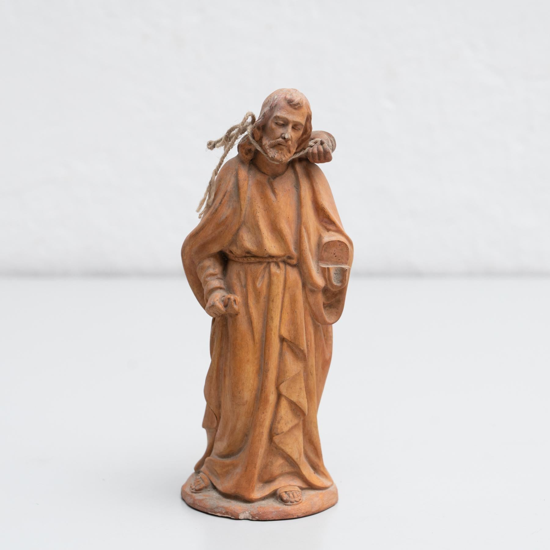 Traditional religious plaster figure of a saint.  Made in traditional Catalan atelier in Olot, Spain, circa 1950.  In original condition, with minor wear consistent with age and use, preserving a beautiful patina.  Olot has a long tradition in the