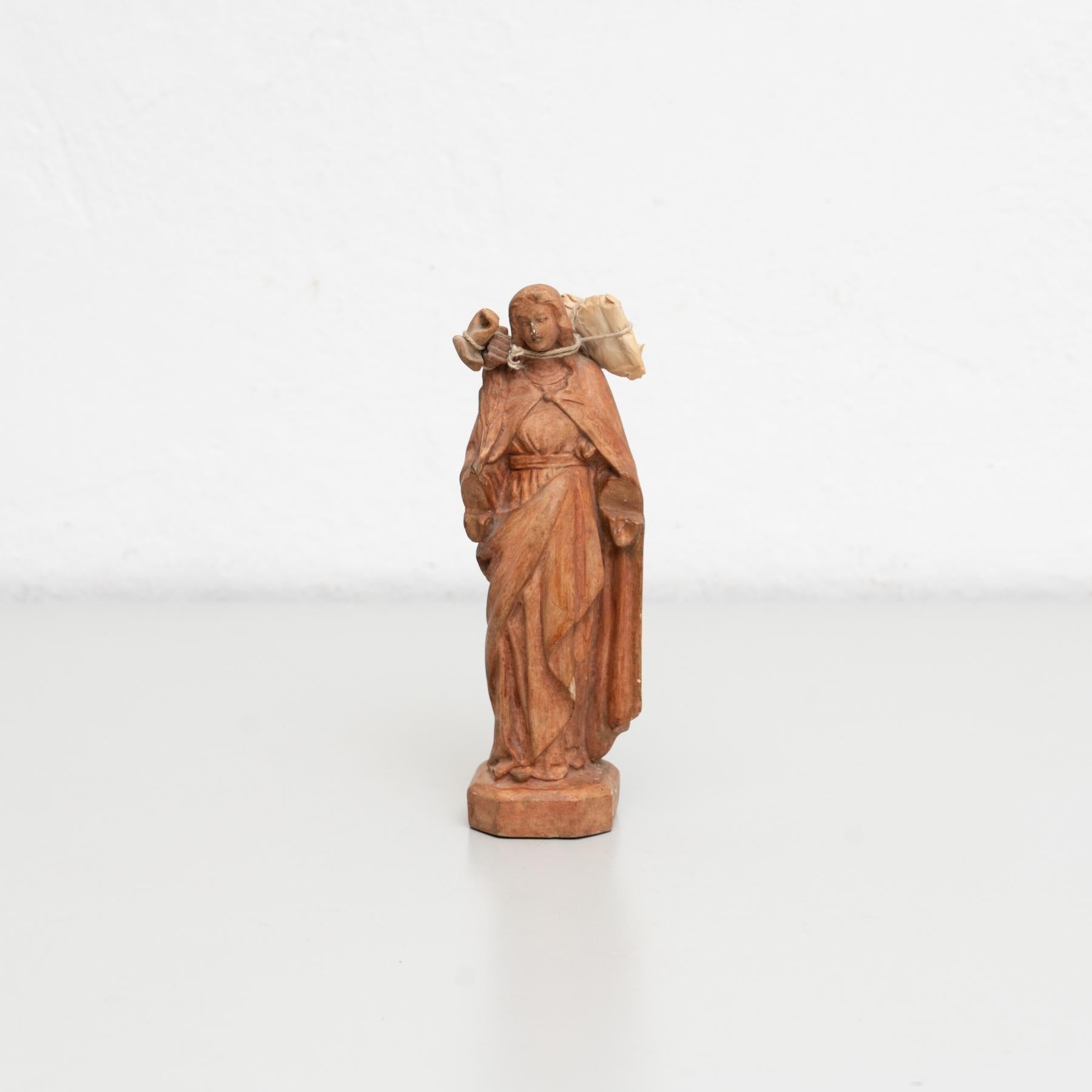 Traditional religious plaster figure of a virgin.  Made in traditional Catalan atelier in Olot, Spain, circa 1950.  In original condition, with minor wear consistent with age and use, preserving a beautiful patina.  Materials: Plaster.     