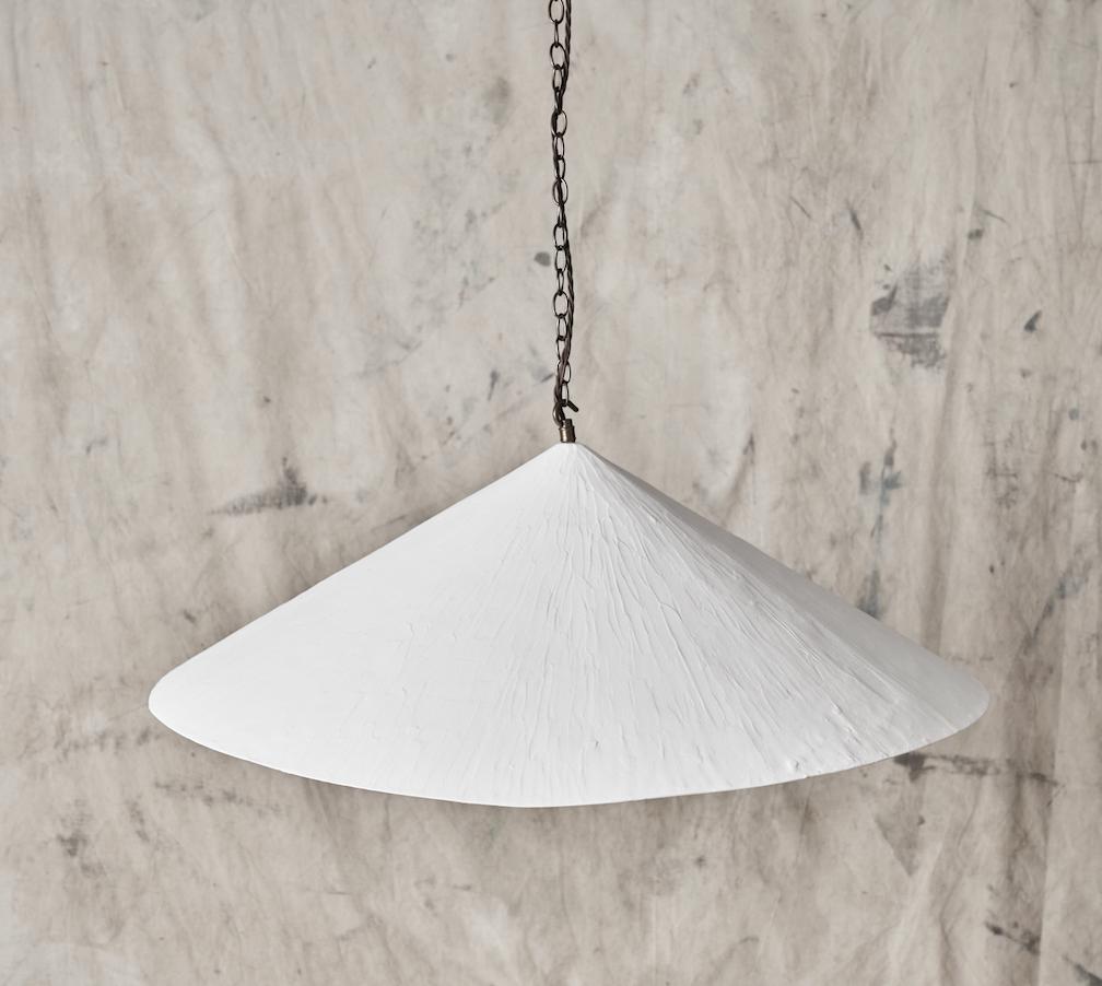 Our bestselling wobble light offers a distinctive and modern aesthetic whilst retaining a hand crafted textured quality.
The plaster material has a chalky soft look, which, combined with the angles and the wonky bottom edge make it a unique and