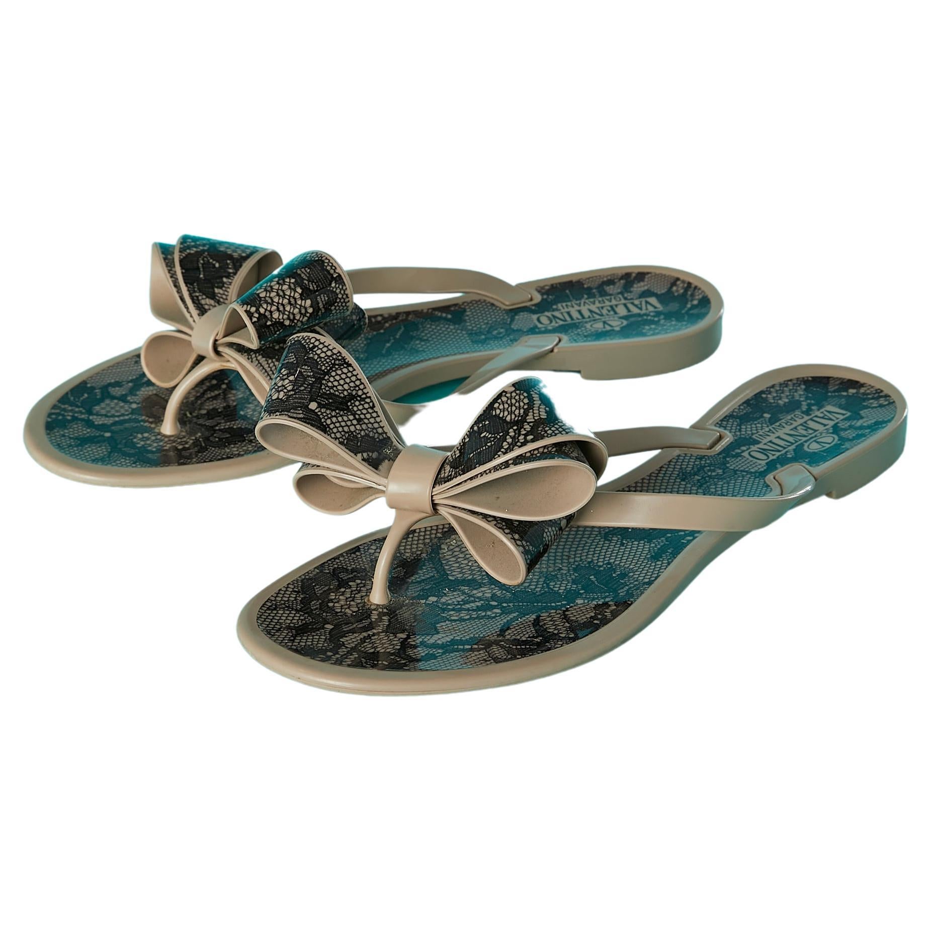 Plastic flip-flop with black lace print and bow Valentino Garavani  For Sale