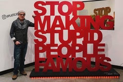 "Stop Making Stupid People Famous" large wood with polyurethane insallation