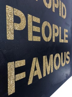 "Stop Making Stupid People Famous" -gold on black diamond dust stencil on canvas