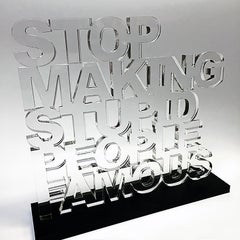 "Stop Making Stupid People Famous" - Clear Acrylic Sculpture with Black Acrylic 