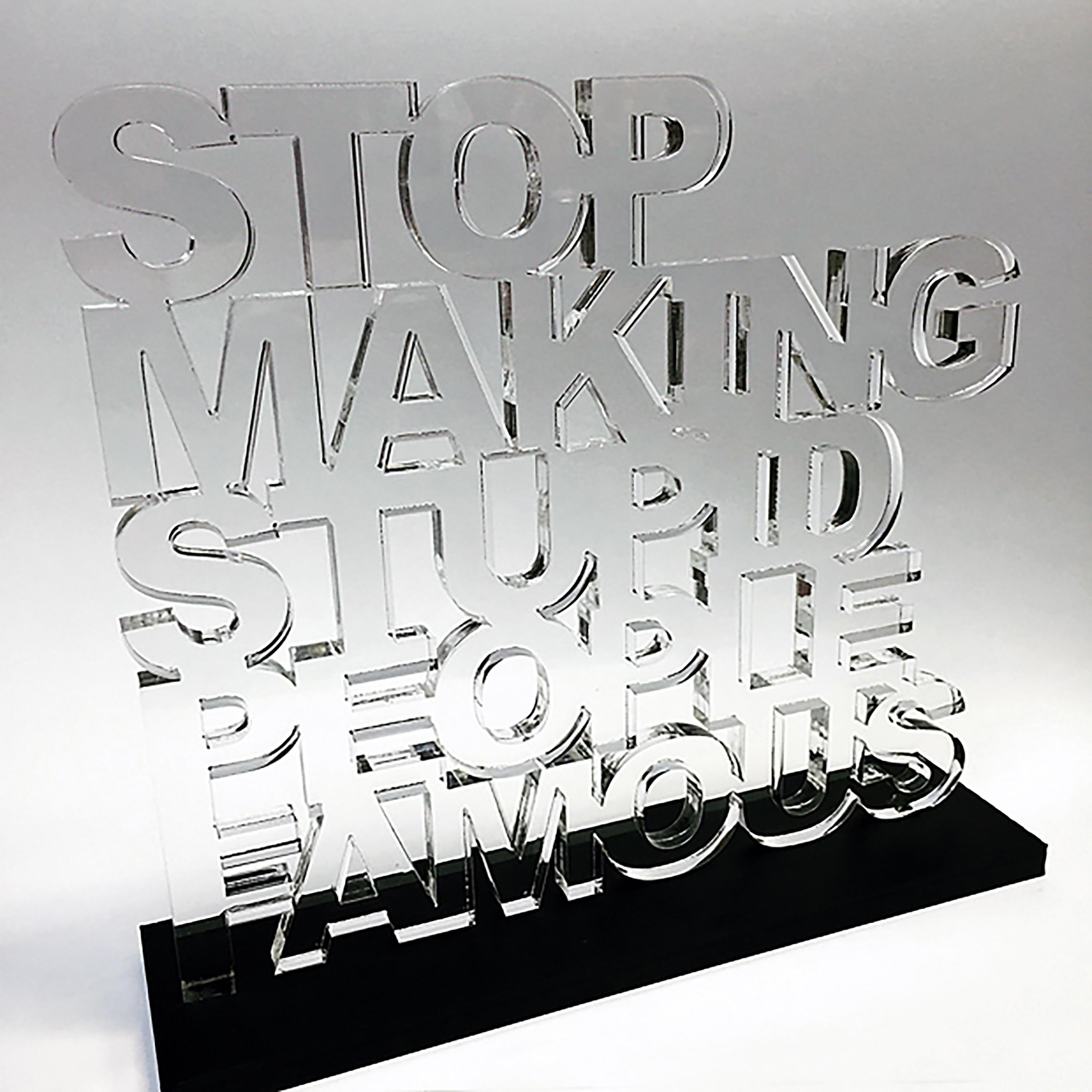 Plastic Jesus Figurative Sculpture - "Stop Making Stupid People Famous" - Clear Acrylic Sculpture with Black Acrylic 