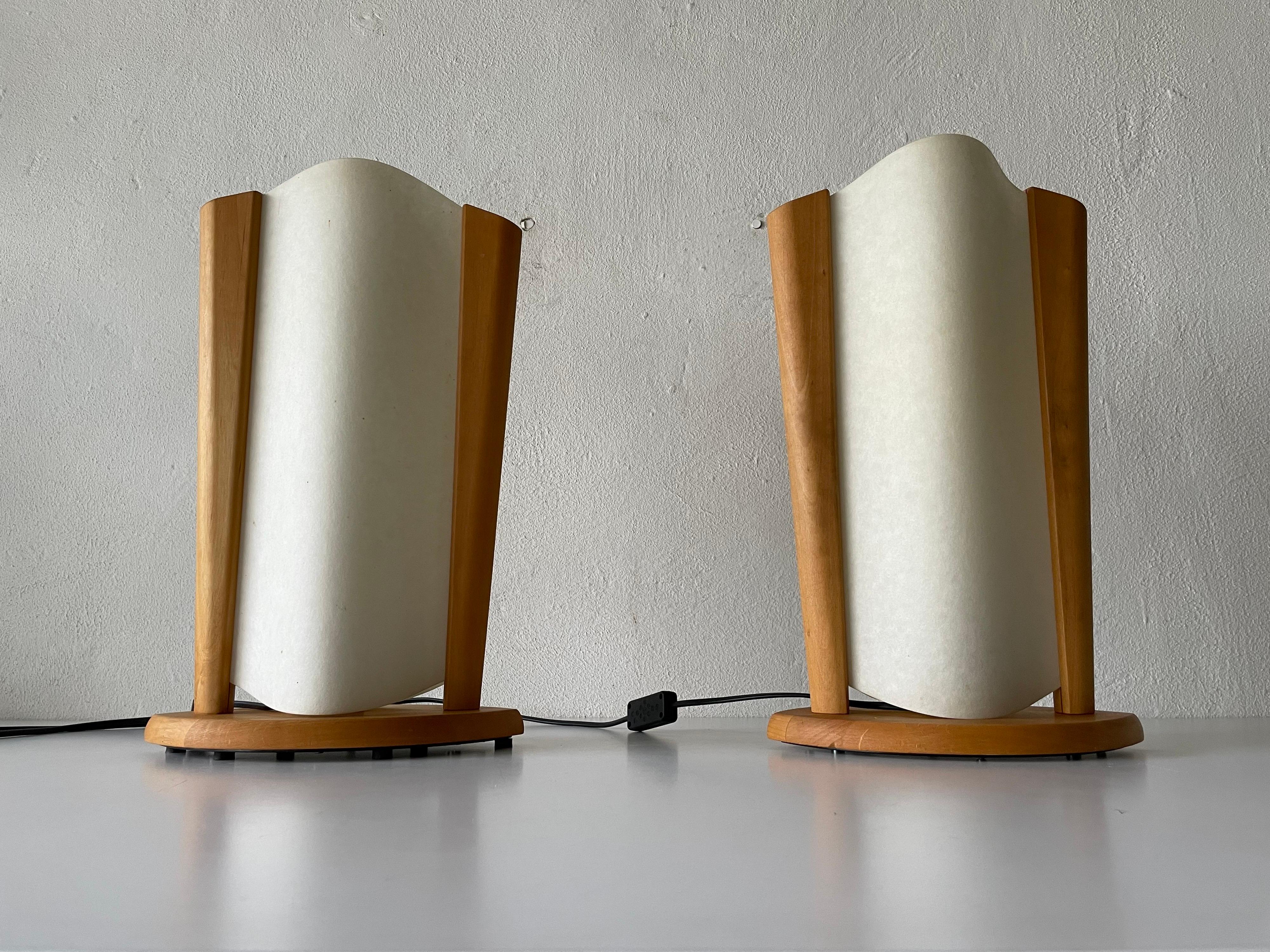Plastic paper and wood frame pair of table lamps by Domus, 1980s, Italy

Minimal design 
Very high quality.
Fully functional.

Original cable and plug. Switch on-off on the cable. 
This lamp is suitable for EU plug socket. 

Lamps are in