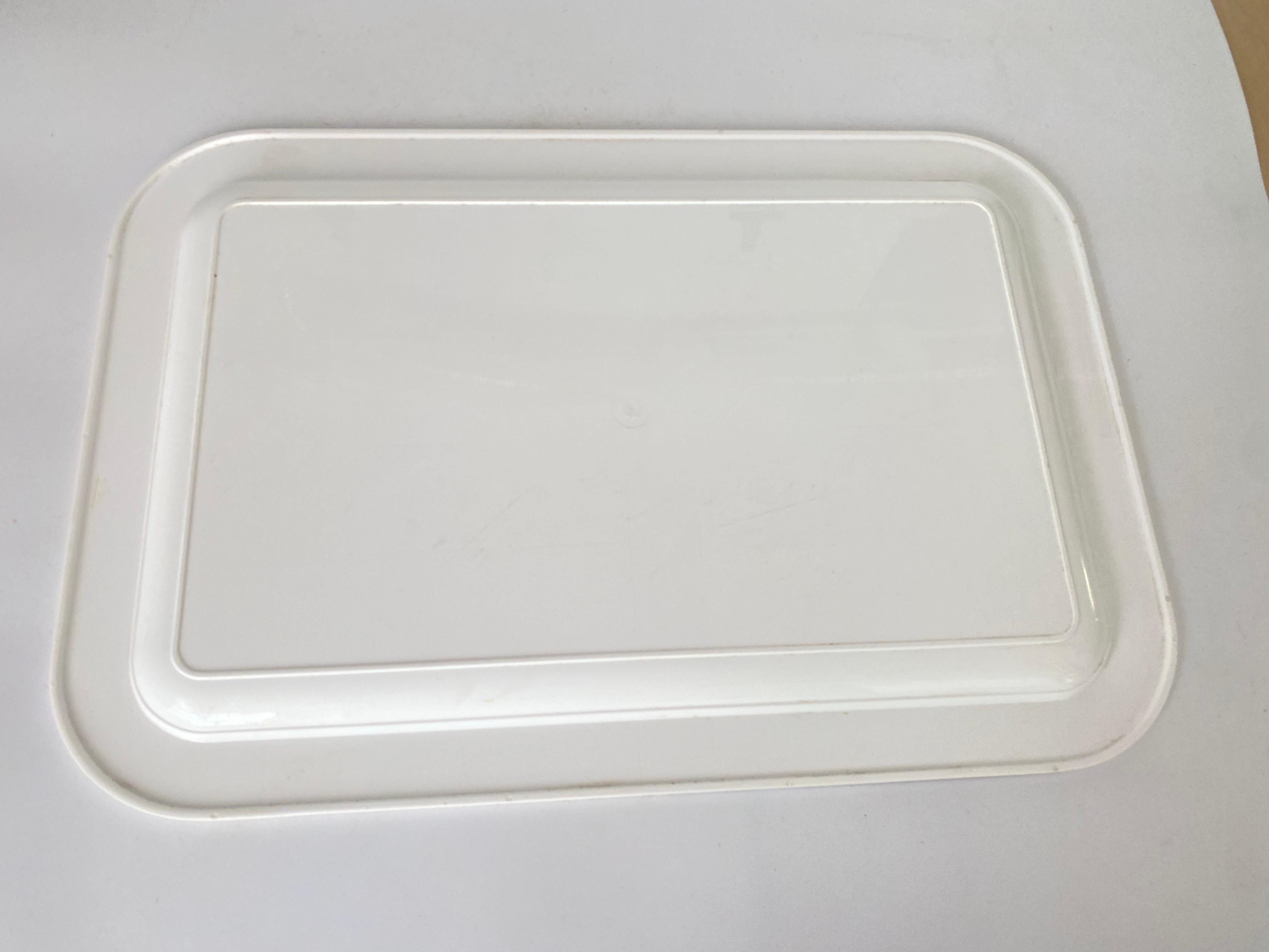 This  tray or platter is from France. It has been made in the 1970s.
White yellow and grey Color.
Plastic