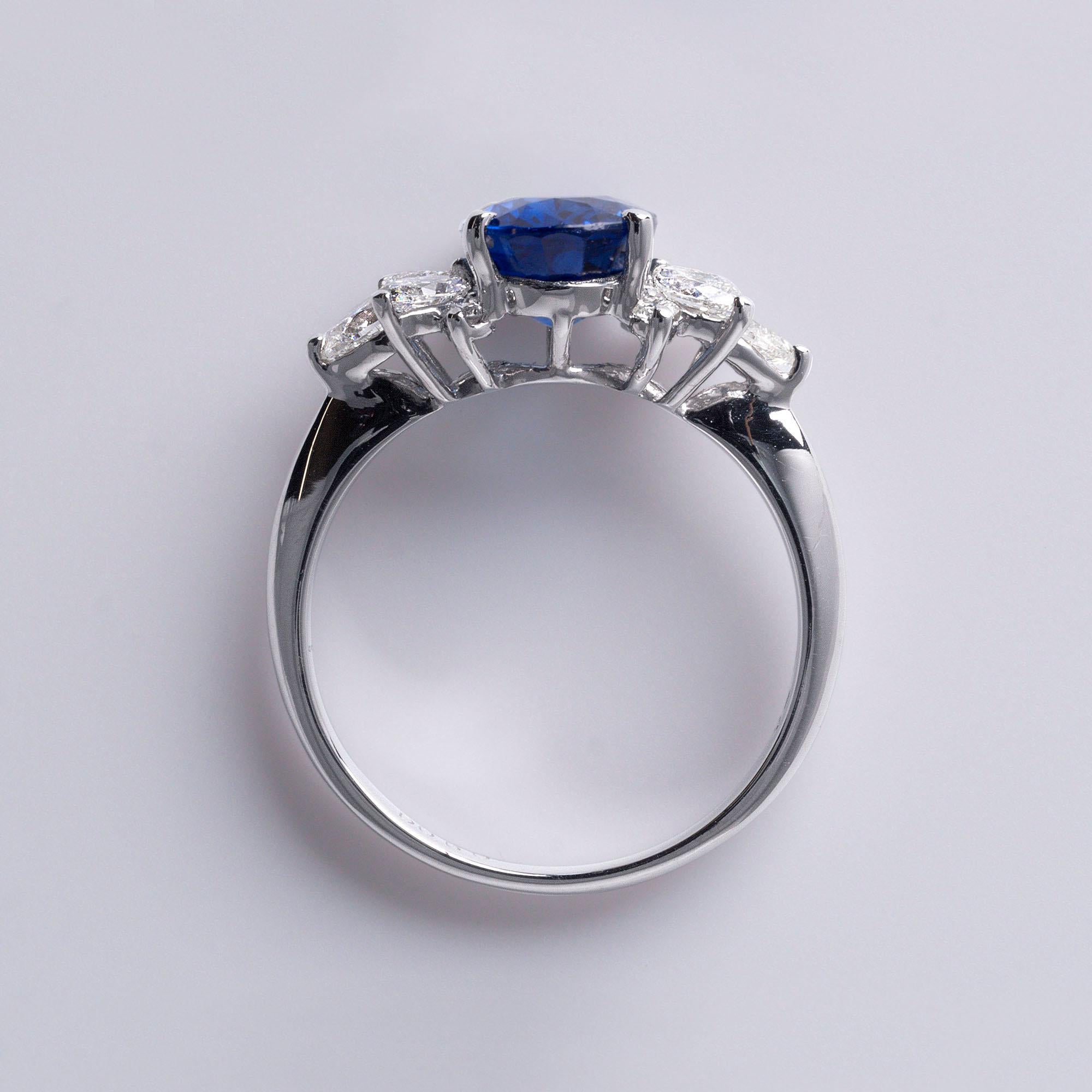 Plat 2.70 Carat Oval Blue Sapphire Ring with Marquise & Pear Diamond Accents In Excellent Condition In Los Angeles, CA