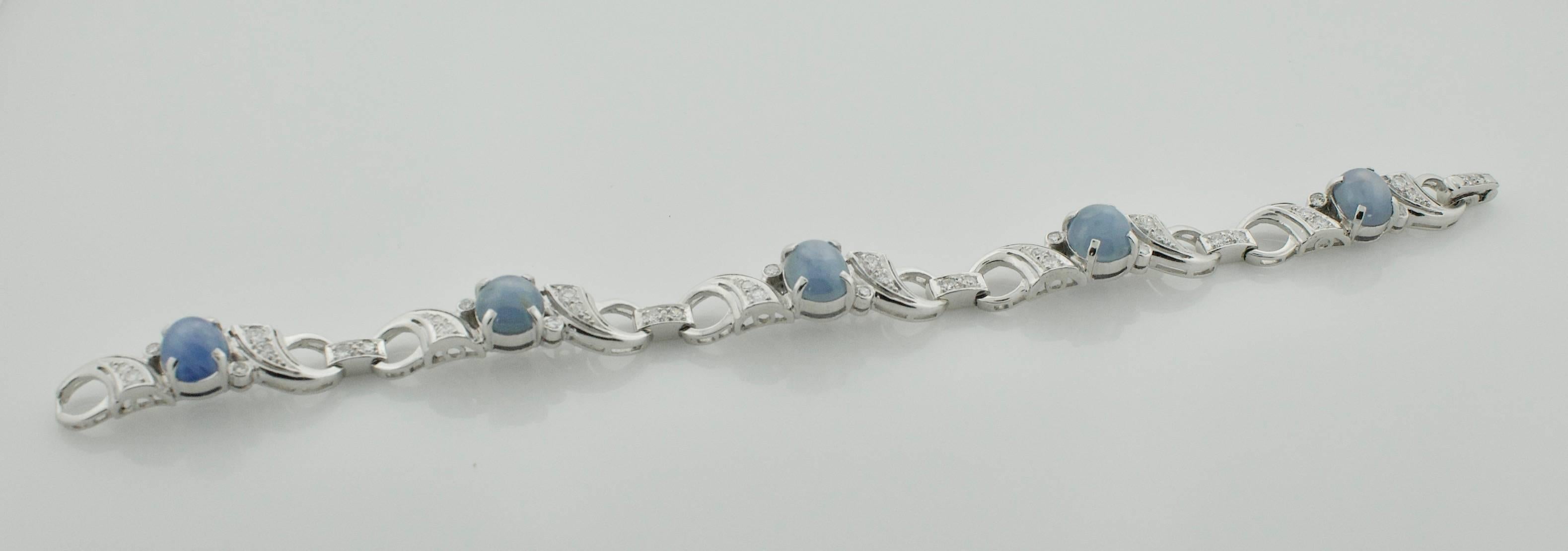 Plat. Star Sapphire and Diamond Bracelet  Circa 1940's 18.40 carats in Sapphires
Five Cabochon Star Sapphires weighing 18.50 carats approximately  [Very Strong Stars, The Top Picture is in Sunlight but does not accurately represent their