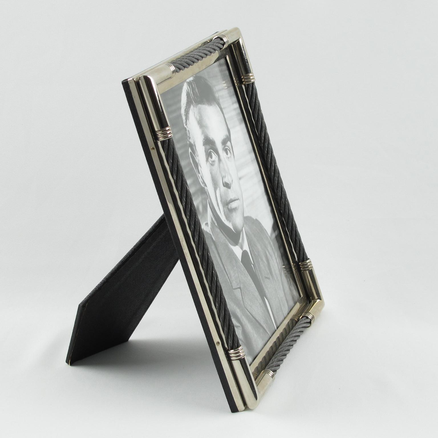 Elegant picture photo frame by Plata Lappas SA, Argentina. Very chic design with silver plate framing ornate with stainless steel cable. Marked on edge: Plata Lappas SA - made in Argentina. Back and easel covered with textured black paper. The