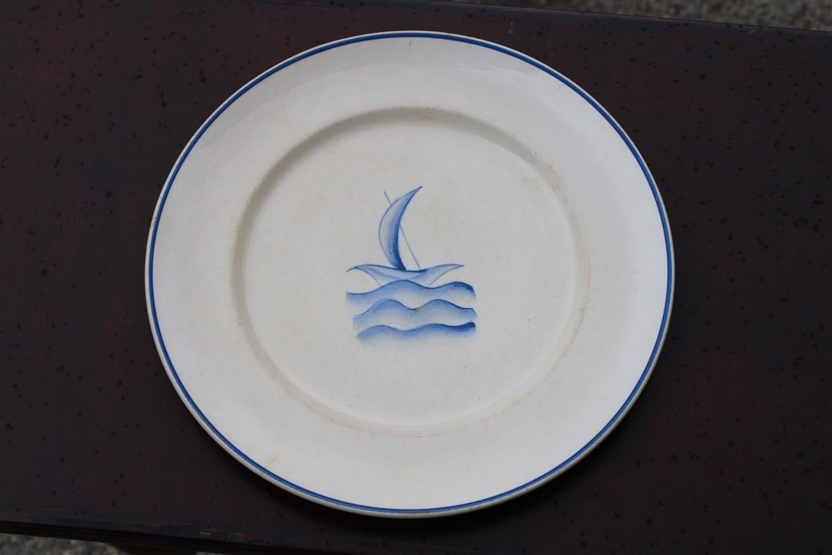 Plate by Gio Ponti from 1930 with a small boat on the waves of the blue sea San Cristoforo