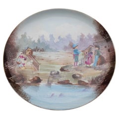 Assiette décorée et peinte à la main en 1930 avec des enfants et la campagne Porcelaine 