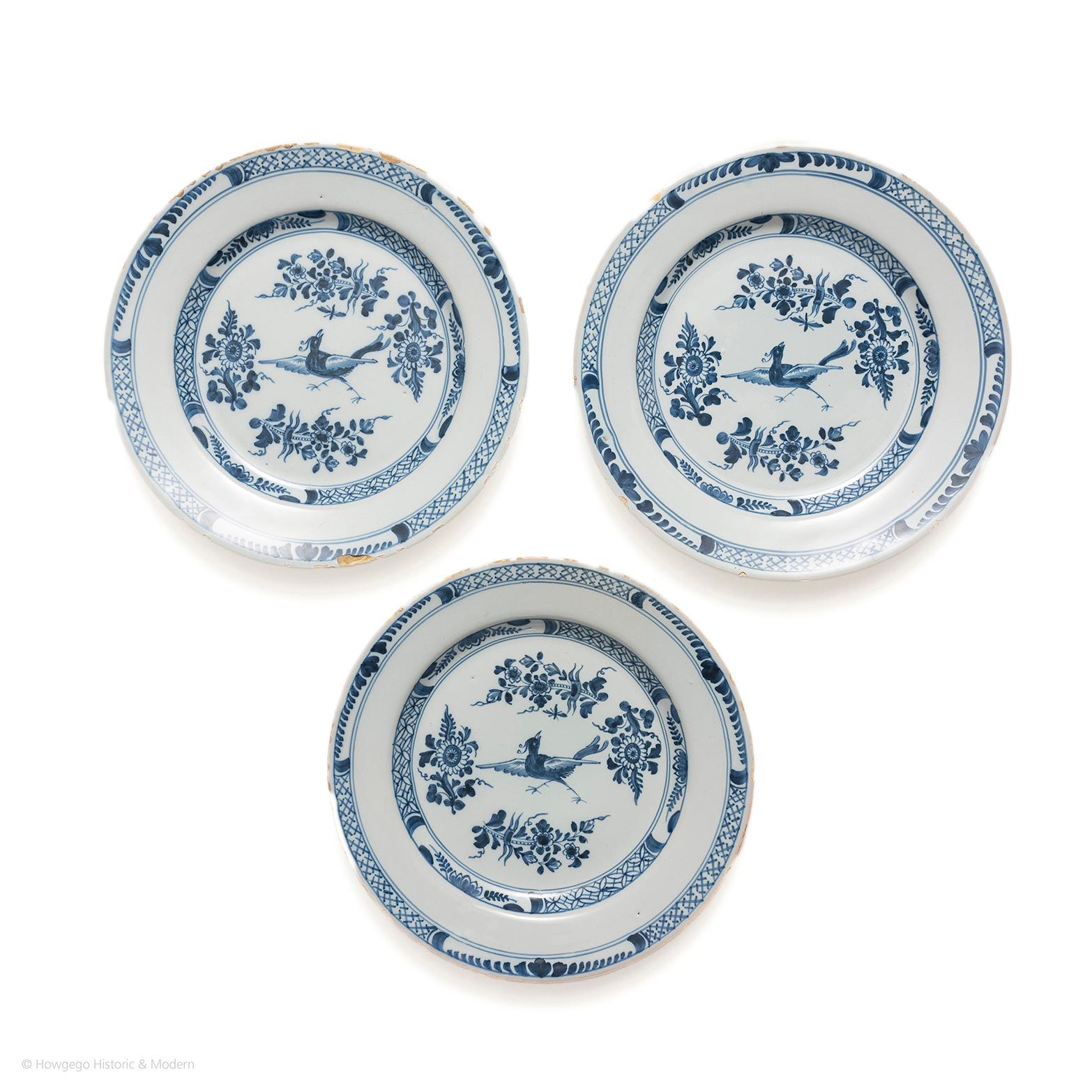 Charming set of plates with the exotic bird suspended showing the fantasy element of Chinoiserie.

Decorated with an exotic bird in flight surrounded by four stylised floral sprays surrounded by a trellis diaper border with four demi-flowerhead