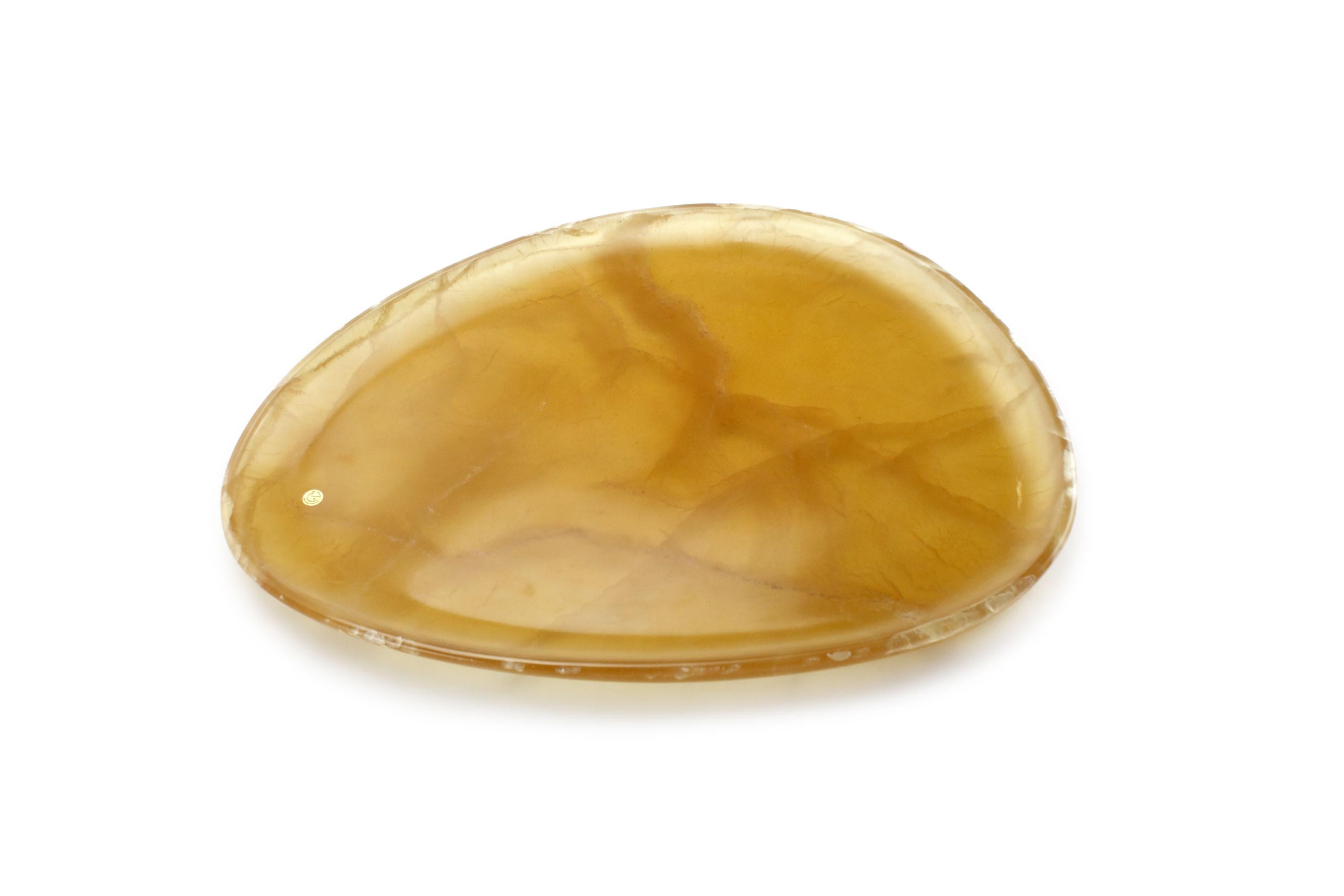 Hand carved presentation plate from Amber onyx. Multiple use as plates, platters and placers. The polished finishing underlines the transparency of the onyx making this a very precious object. 

Dimensions: Medium - L 30 W 28 H 1.8 cm, also