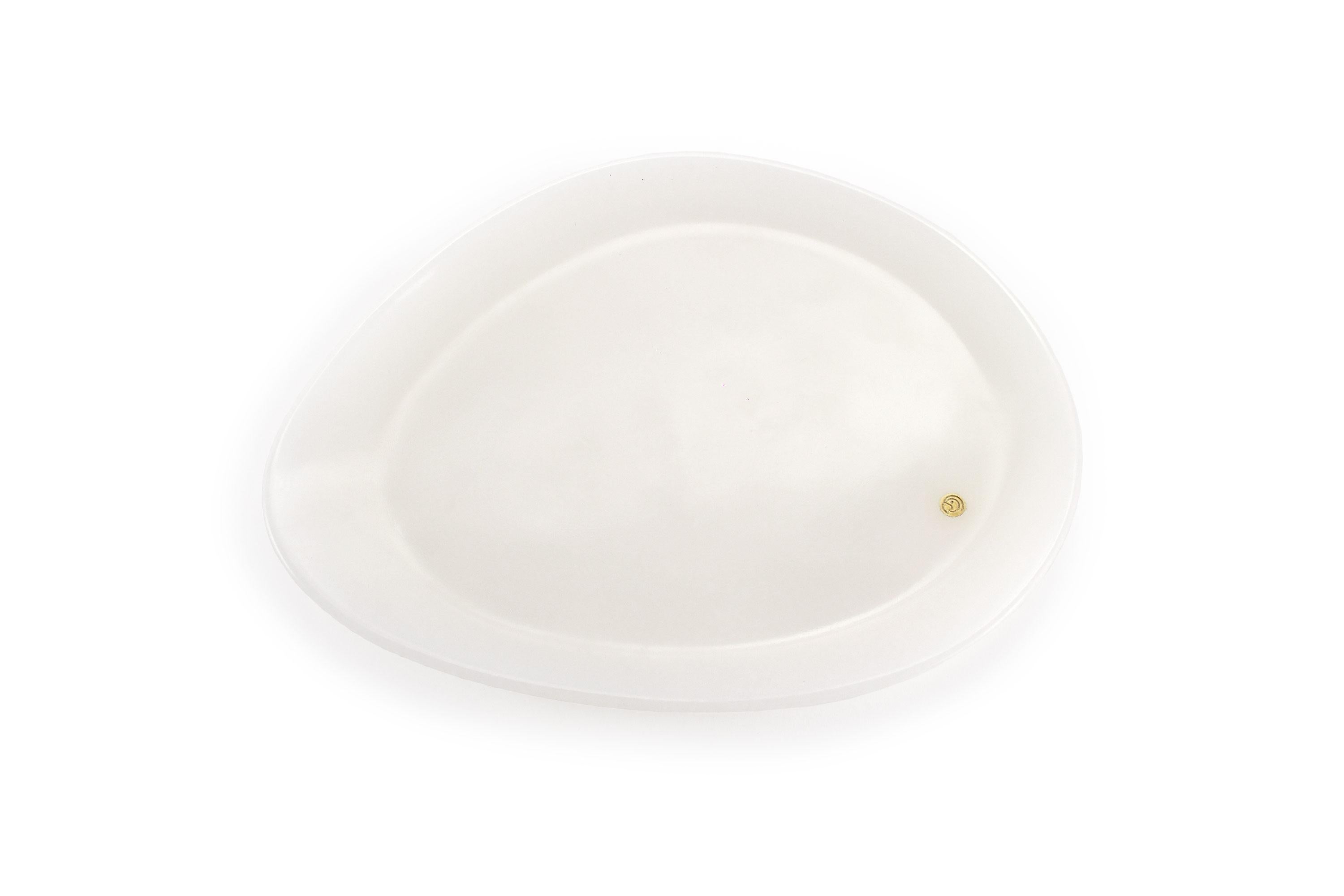 Hand carved presentation plate from White onyx. Multiple use as plates, platters and placers. The polished finishing underlines the transparency of the onyx making this a very precious object. 

Dimensions: Small L 24, W 20, H 1.8 cm, also