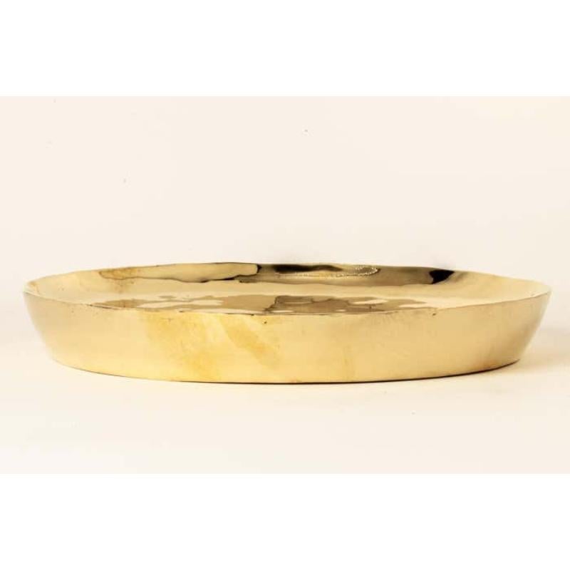 This plate is hand-made in polished brass. Crafted with meticulous care, it is a masterpiece of metalwork. Every inch is a testament to artisanal skill, with each section cut and shaped by hand. The result is a three-dimensional marvel that marries