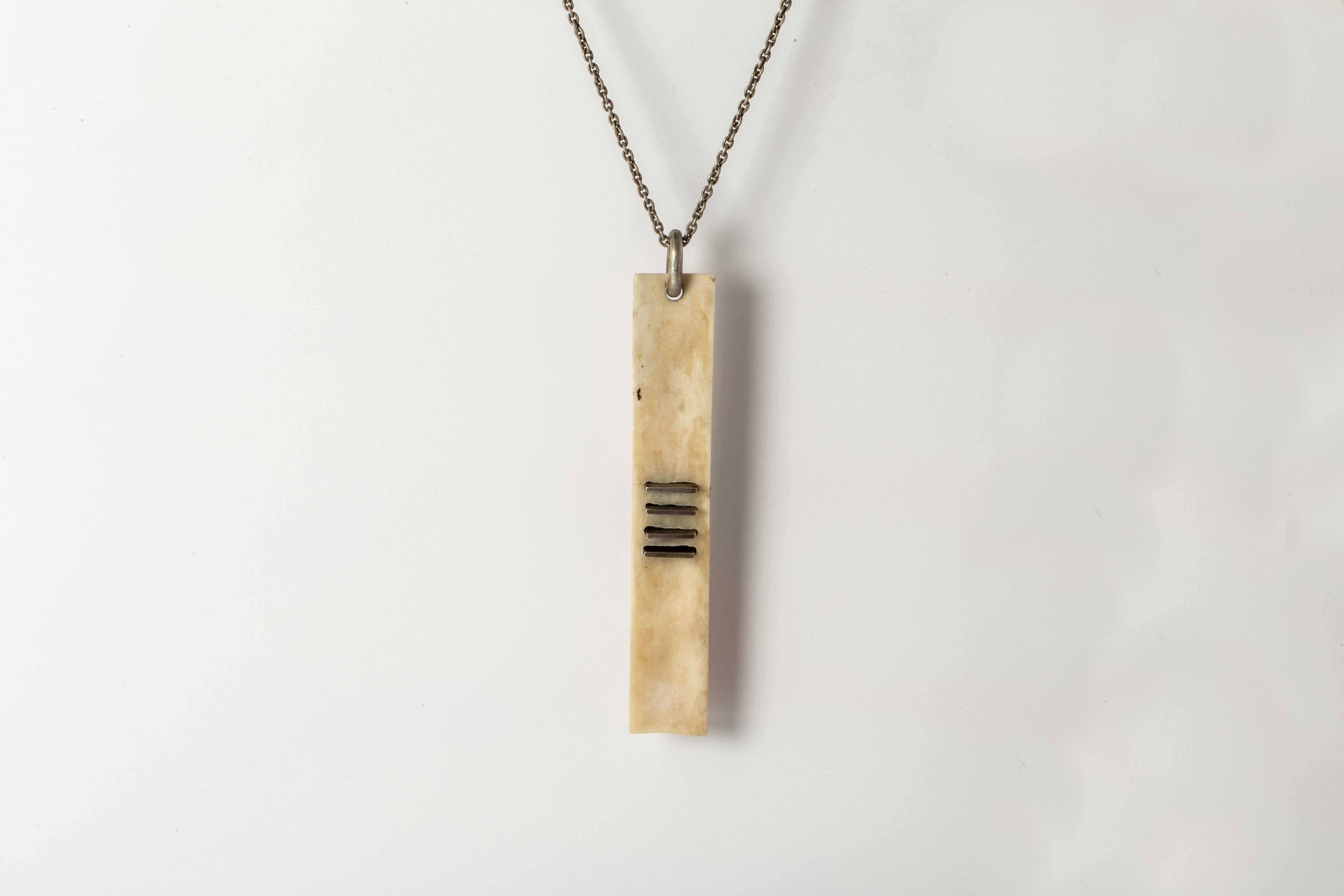 Handcarved plate necklace made of bone with sterling silver slabs, it comes on a 74cm sterling silver chain.