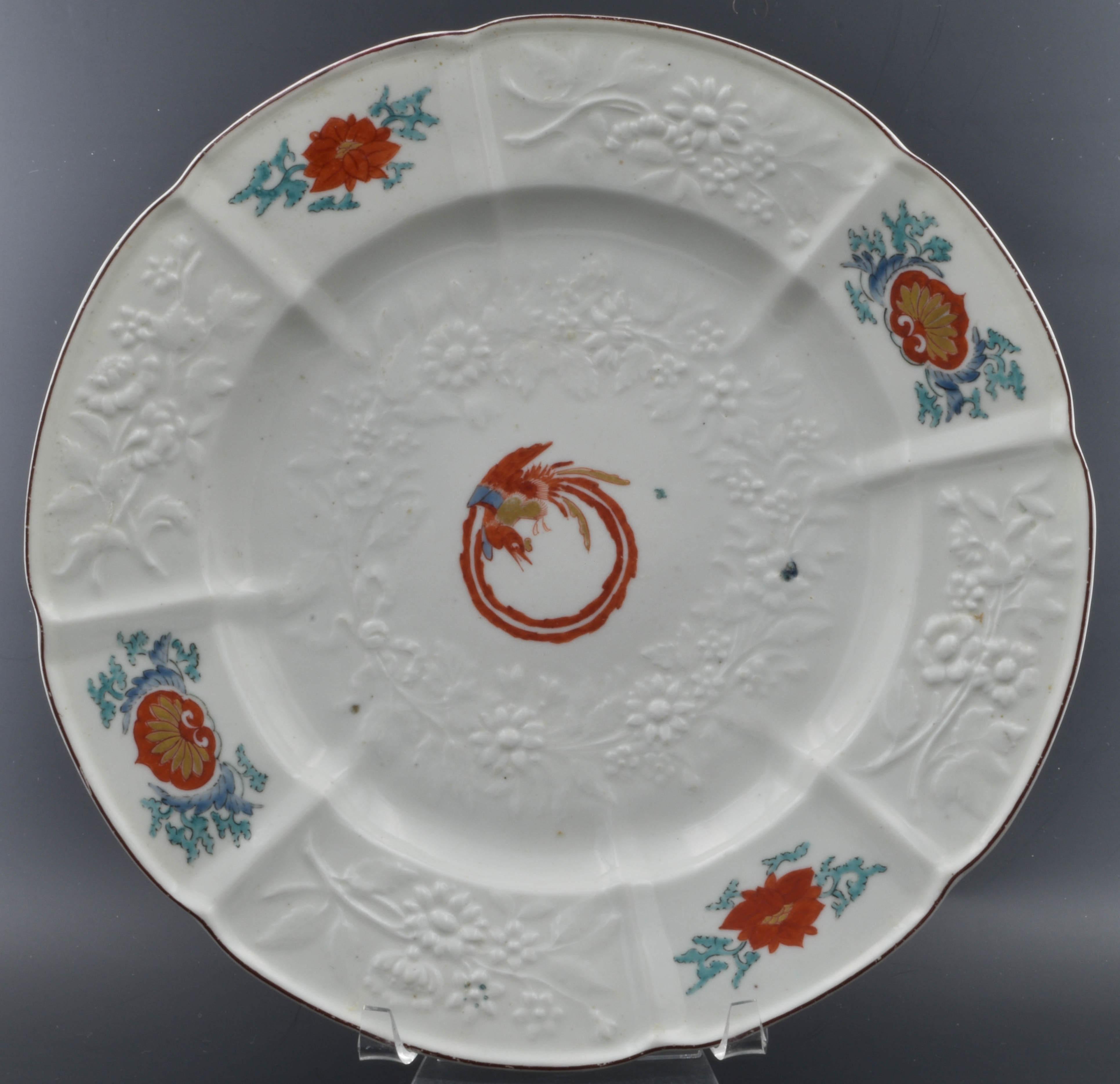A very fine plate, damasked with Gotzkowsky erhaben Blumen. Decorated after the Japanese with peonies and a coiled phoenix to the centre, using the Kakiemon palette.

The coiled phoenix is a traditional design that appears on various forms of