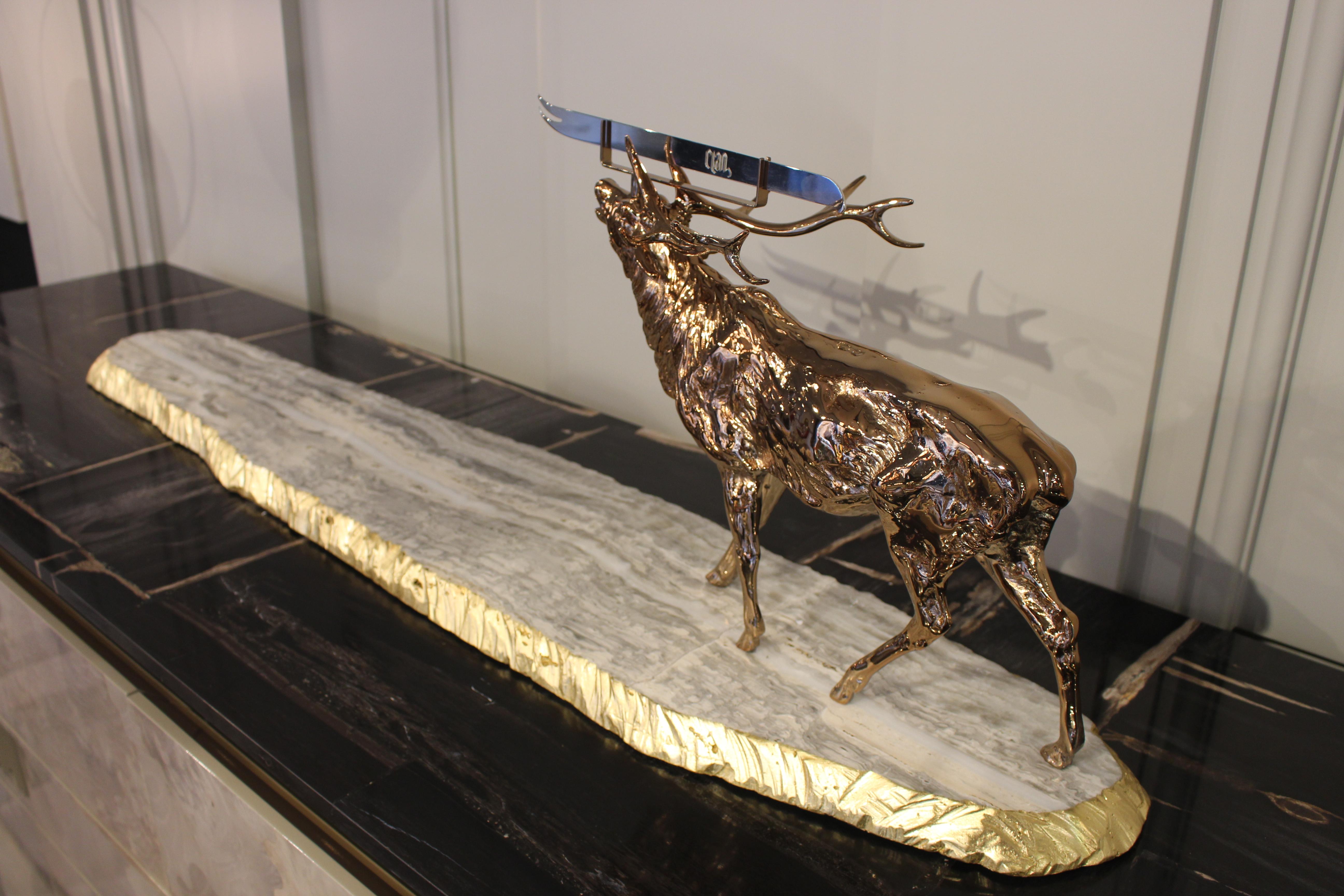 Marble base with hand split border in copper leaf. Deer sculpture in cast brass. Stainless steel knife.