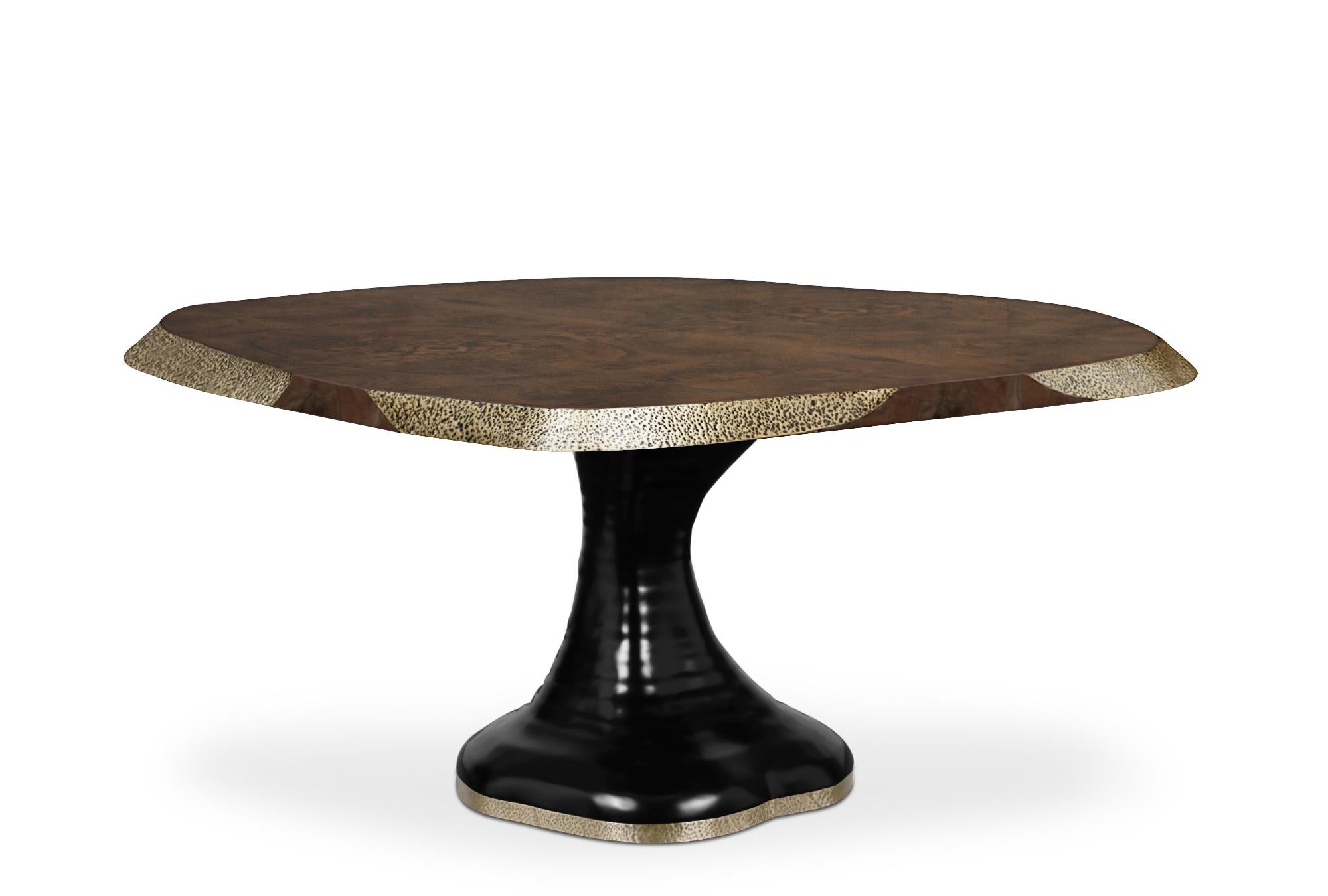 Monument Valley, in Arizona, is one of the greatest icons of the American West landscape. It inspired the creation of Plateau II dining table. It features a top in walnut root veneer with a matte varnish & details in matte hammered brushed aged