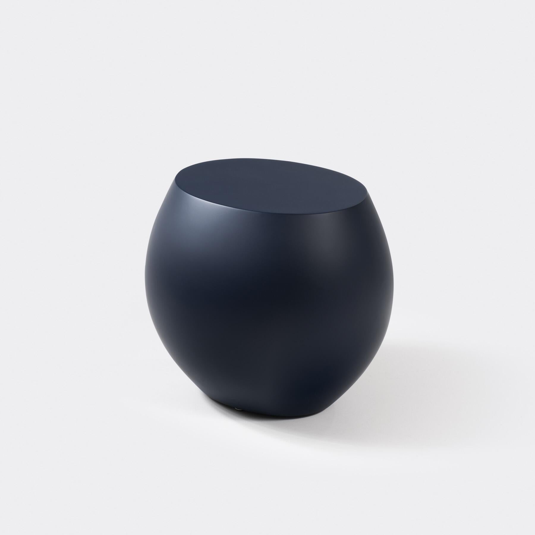 The Plateau Side Table is designed to transition effortlessly between indoor and outdoor environments. Made of durable fiberglass-reinforced concrete, each boulder-like piece has a rounded base and flat surface, calling to mind river stones smoothed