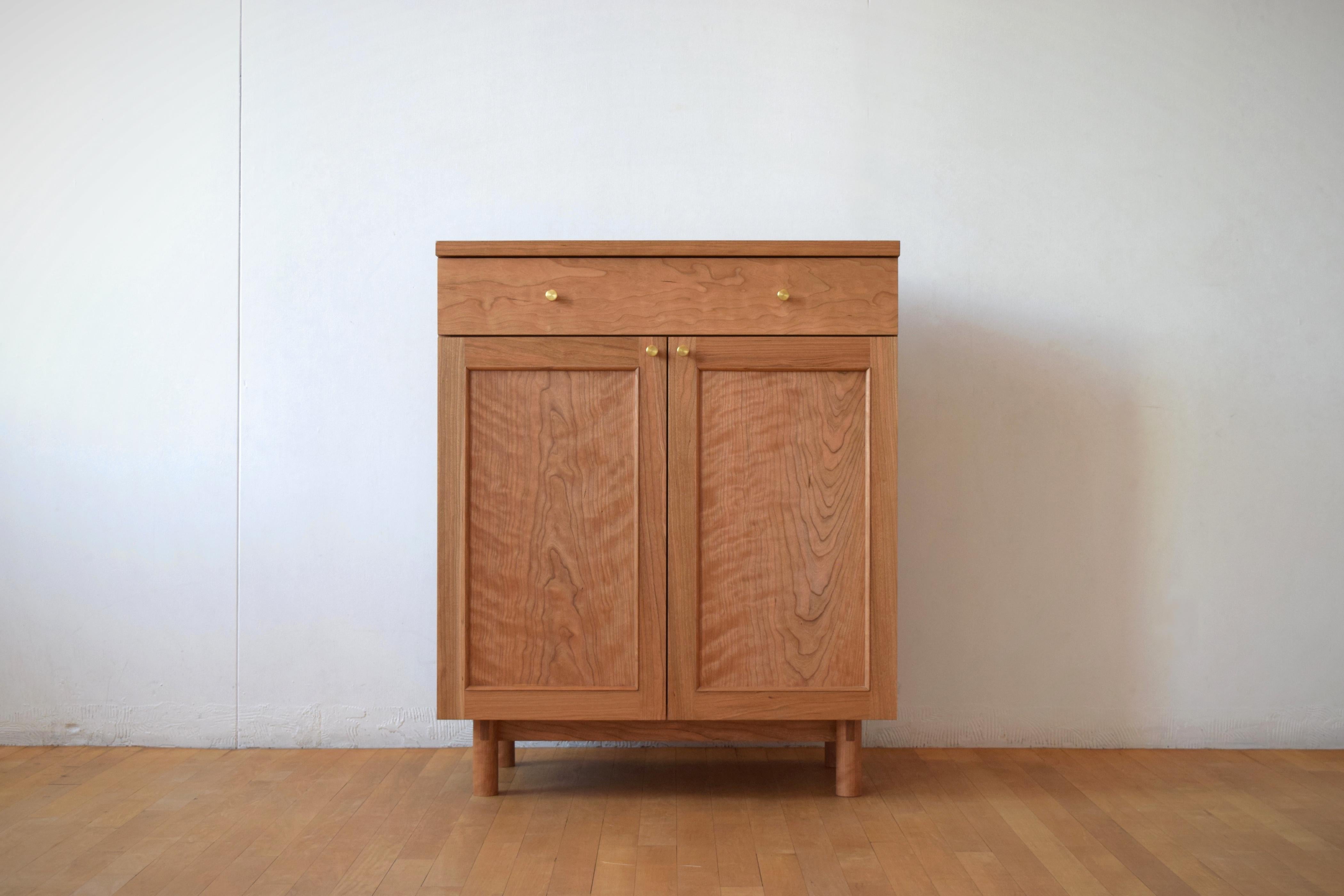 Plateau sideboard is a solid wood cabinet made with brass pulls, under-mount soft close drawer slides, and soft close door hinges. The piece features traditional frame-and-panel figured doors, ship lap backs and adjustable shelving inside. A hand