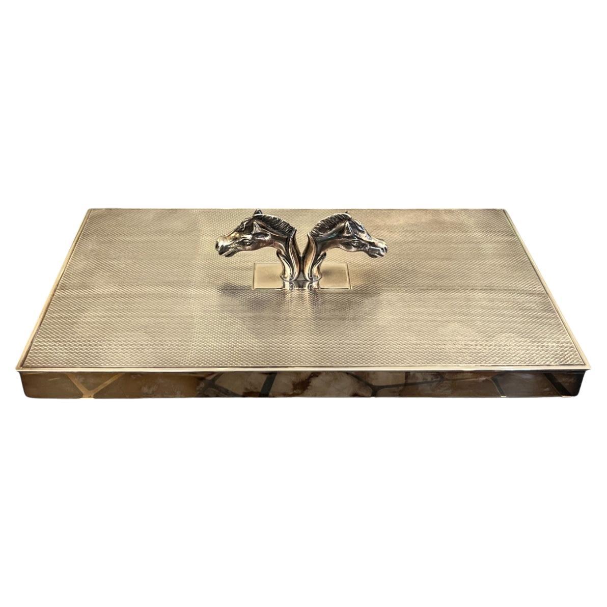 Unique Hermes box with double horse head decoration.