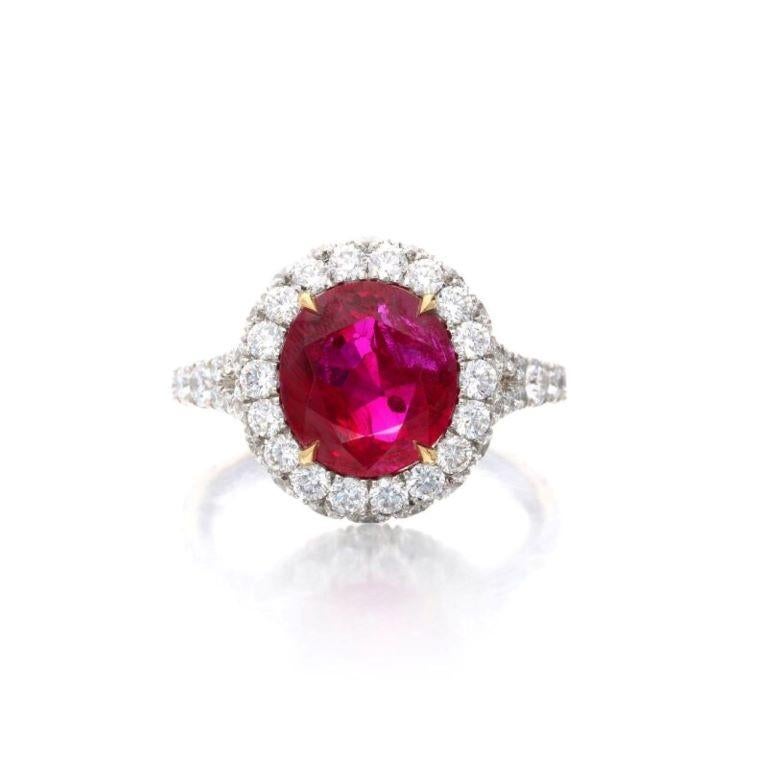 Centering an oval shaped Burmese ruby, accented by round diamonds. Ruby weighs 3.91 carats
 - Diamonds weighing a total of approximately 1.80 carats
 - Platinum and 18 karat yellow gold
 - Total weight 9.88 grams
 - Size 6 
- Accompanied by SSEF