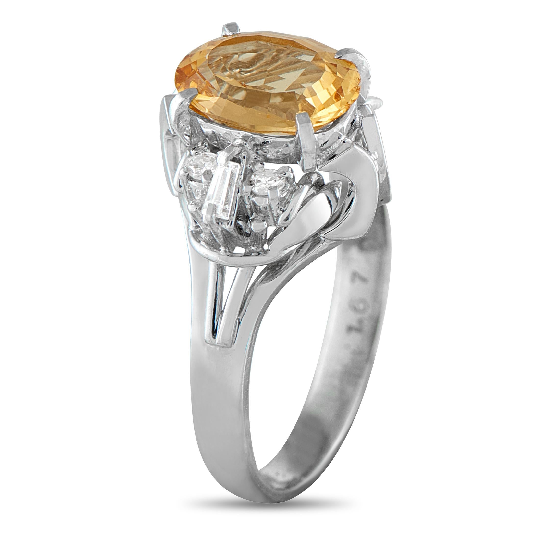 A breathtaking 1.67 carat Imperial Topaz center stone is beautifully showcased by an ornate Platinum setting on this luxury ring. Incredibly chic, Diamond accents totaling 0.16 carats elevate the classic design. It features a 3mm wide band and a