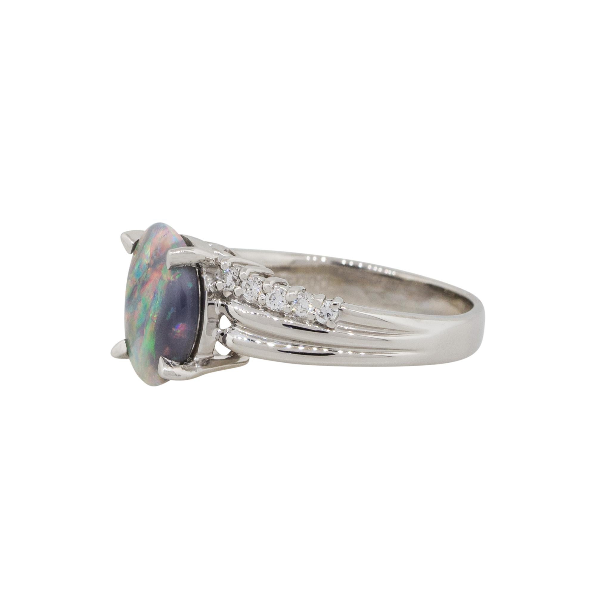 Material: Platinum
Gemstone details: Black oval shape Opal gemstone 
Diamond details: Approx. 0.16ctw of round cut diamonds. Diamonds are G/H in color and VS in clarity
Ring Size: 7.25
Ring Measurements: 0.80