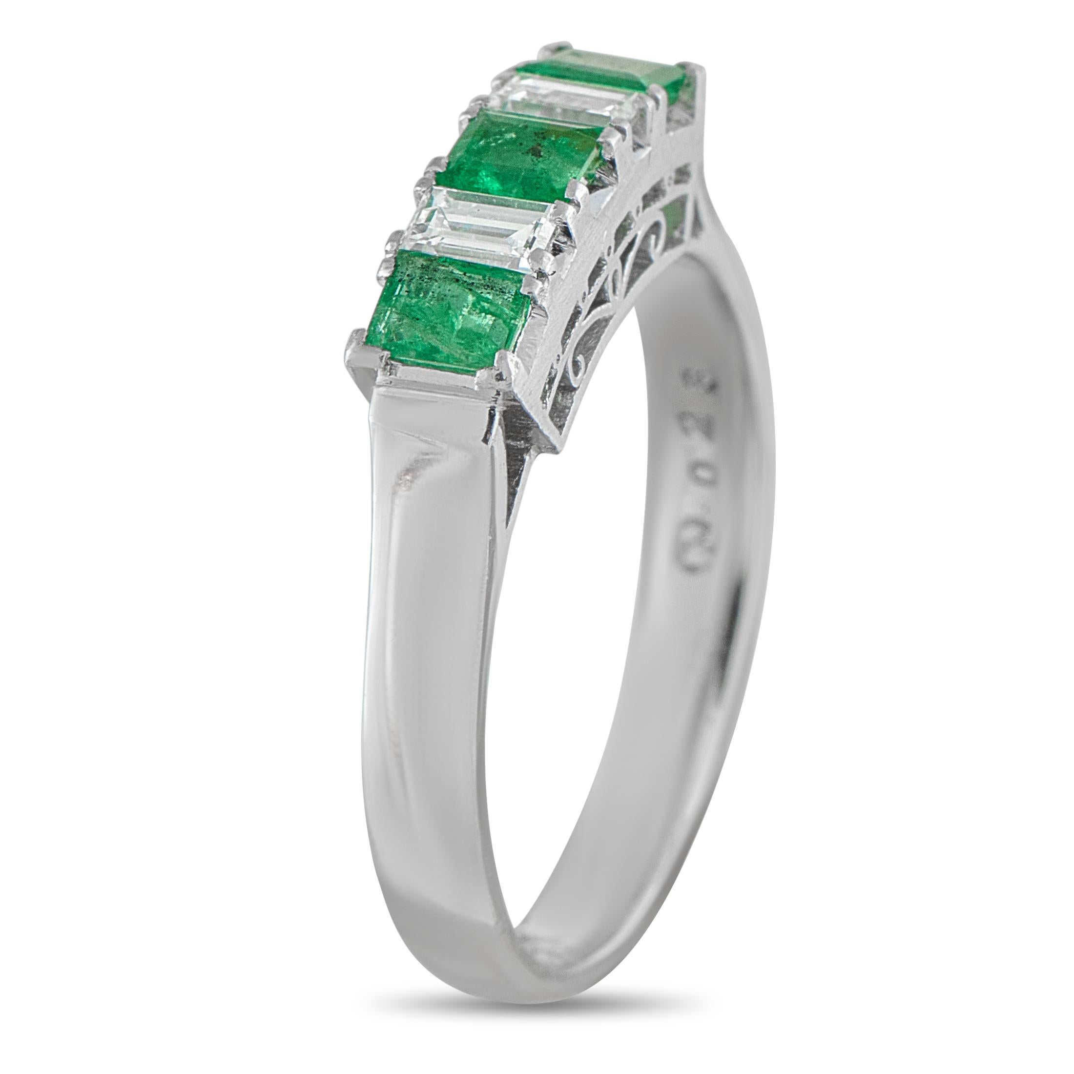 This impeccably crafted ring will continually captivate. Diamonds totaling 0.23 carats alternate with Emeralds totaling 0.47 carats, providing this radiant ring with beautiful contrast. Complete with a detailed Platinum setting, this piece features