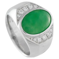 Anello in platino con diamante e giada da 0.23 carati