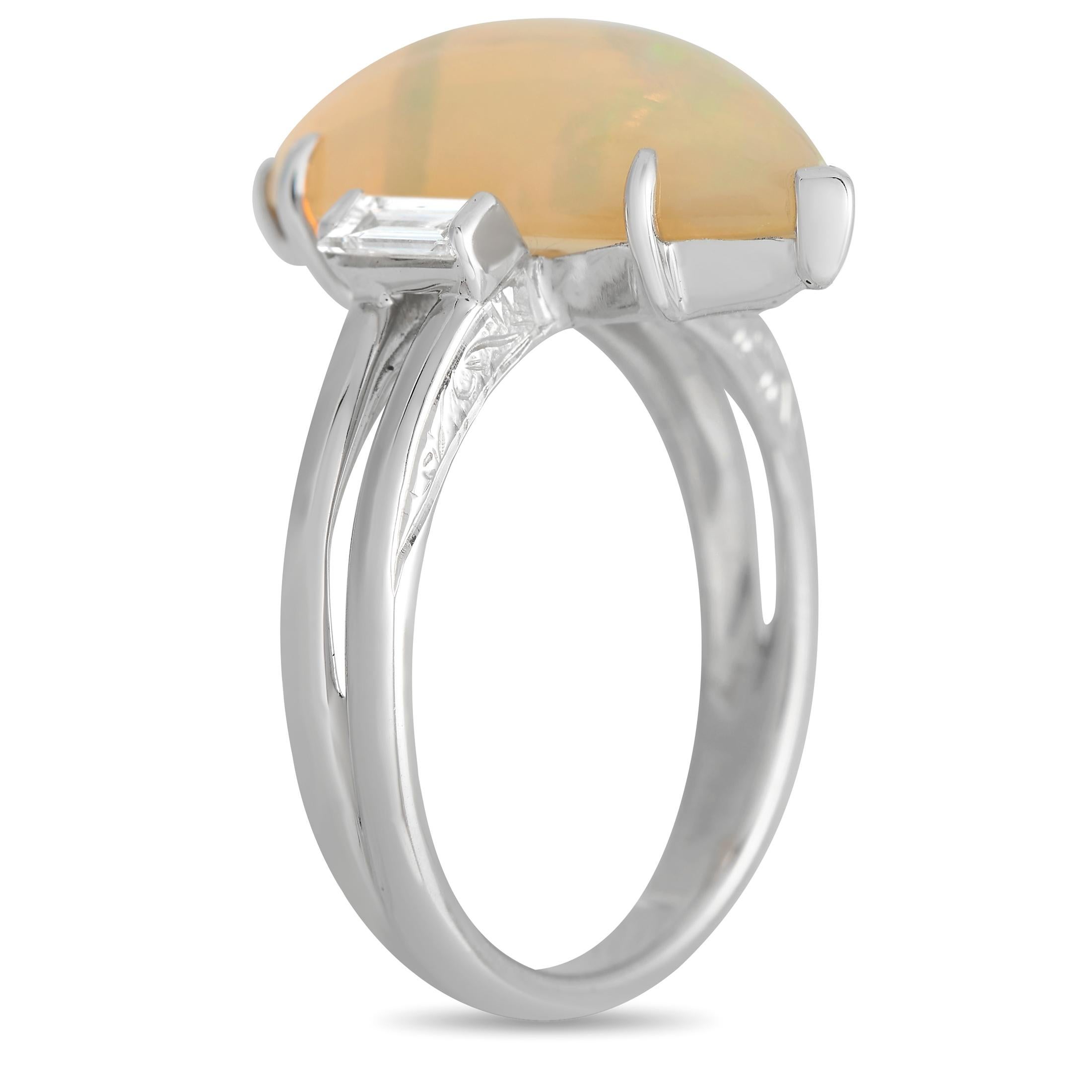 This captivating luxury ring is uniquely elegant. The striking marquise-cut 4.61 carat Opal center stone comes to life thanks to swirling colors, while Diamond accents totaling 0.25 carats provide the perfect amount of sparkle. This piece features a