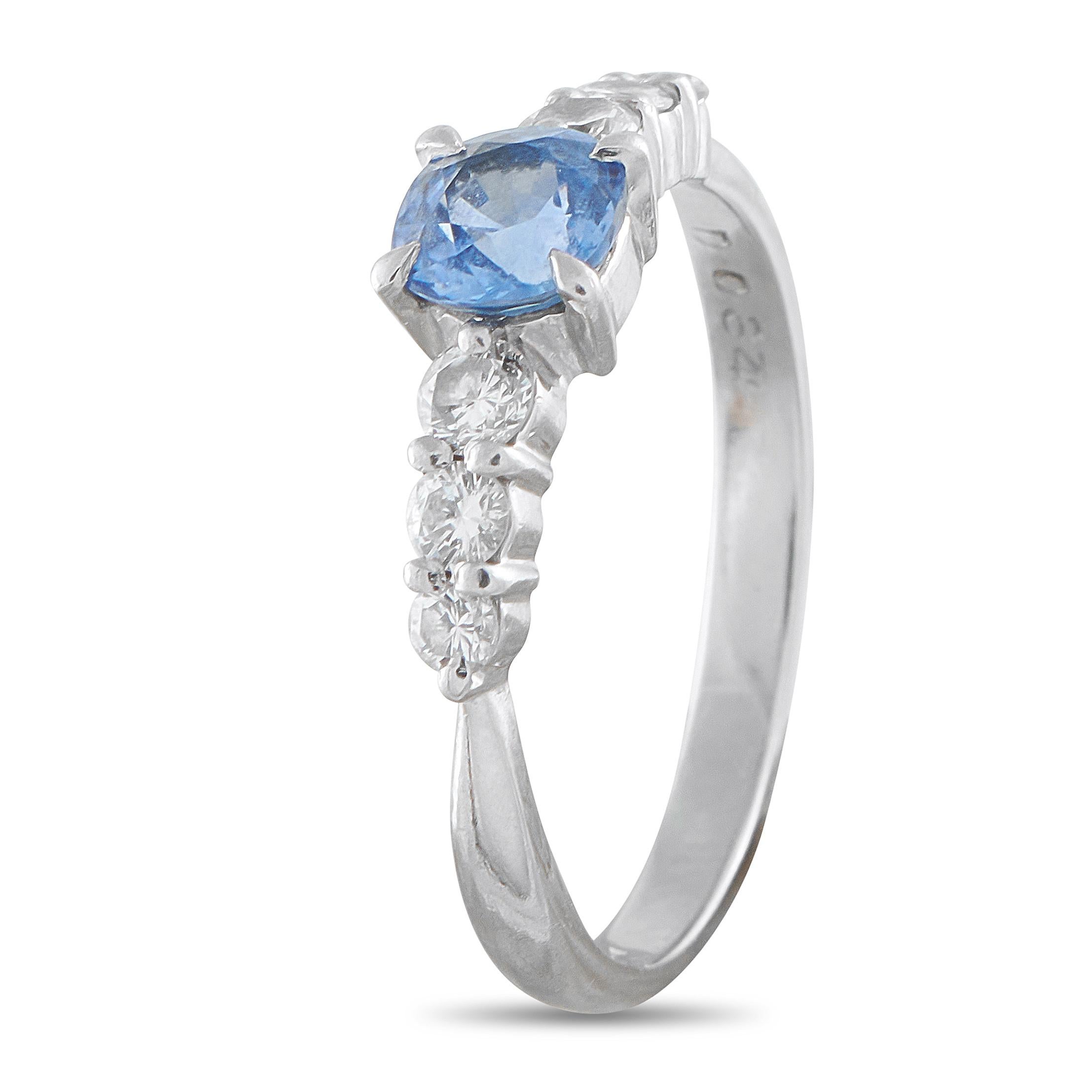 Understated yet arresting, this ring boasts a 0.79 carat sapphire at its center, flanked by trios of brilliant diamonds. The blue hue of the central gem and the cascade of light from the diamond side stones give this ring its sleek and striking