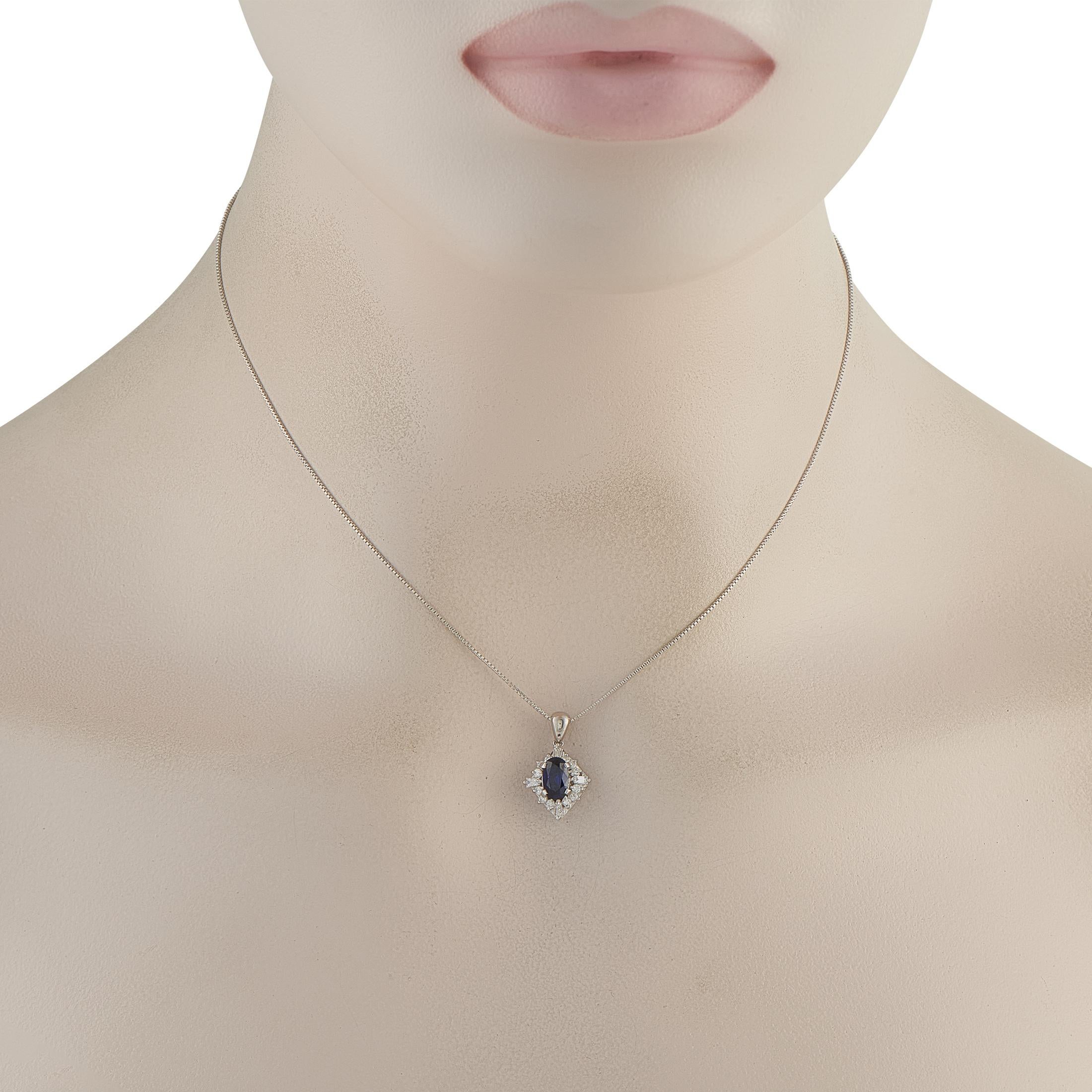 Marked 850 platinum, this necklace explores symmetry through form and proportion. Its pendant features an oval sapphire center, framed by a kite-like arrangement of round diamonds. Each corner is punctuated by a tapered baguette-cut diamond,